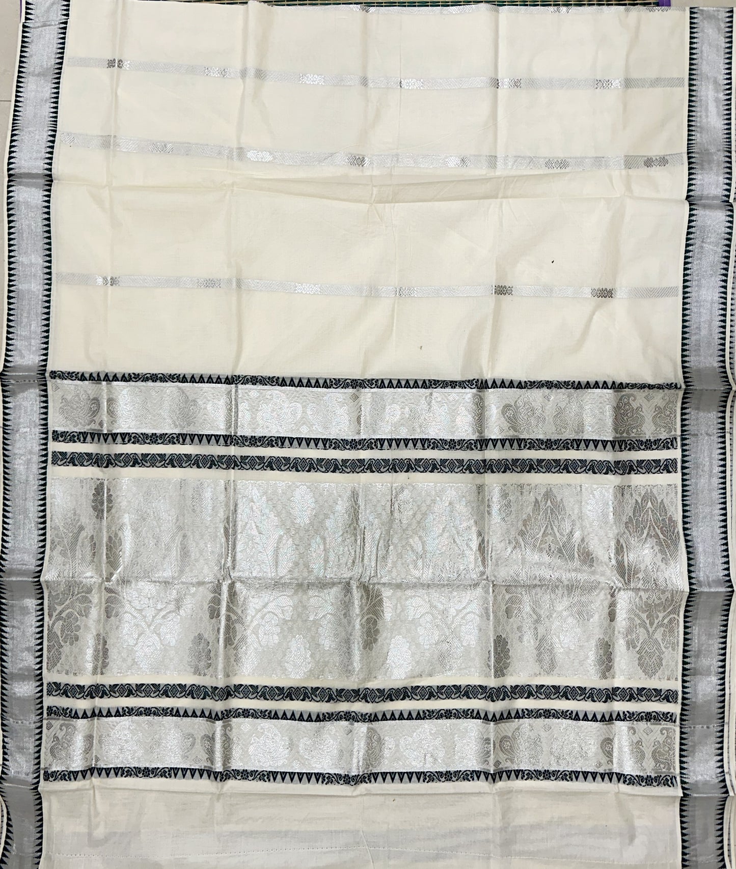 Southloom Silver Kasavu Saree with Elaborate Work Across Body and Green Kara