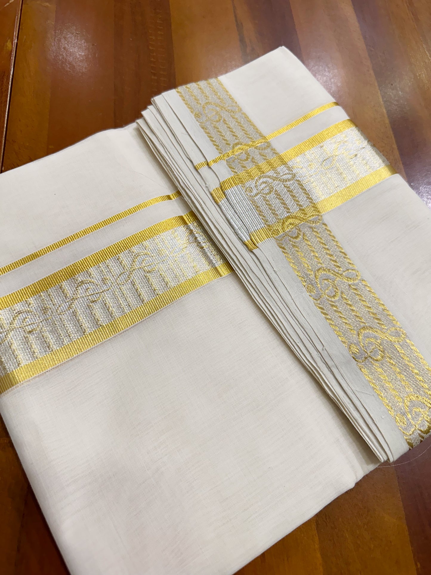 Southloom Balaramapuram Unakkupaavu Handloom Gold and Silver Kasavu Mundu with Woven Work in Kara and Border