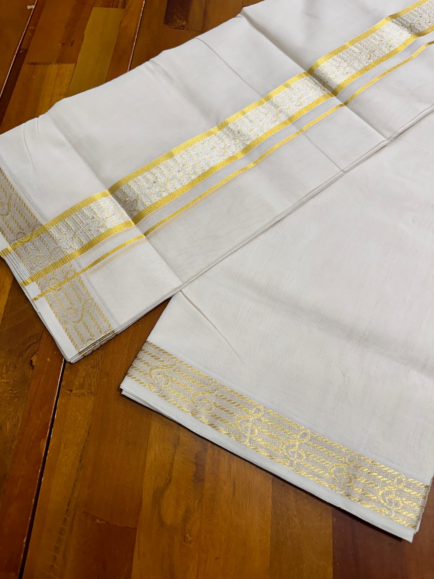 Southloom Balaramapuram Unakkupaavu Handloom Gold and Silver Kasavu Mundu with Woven Work in Kara and Border