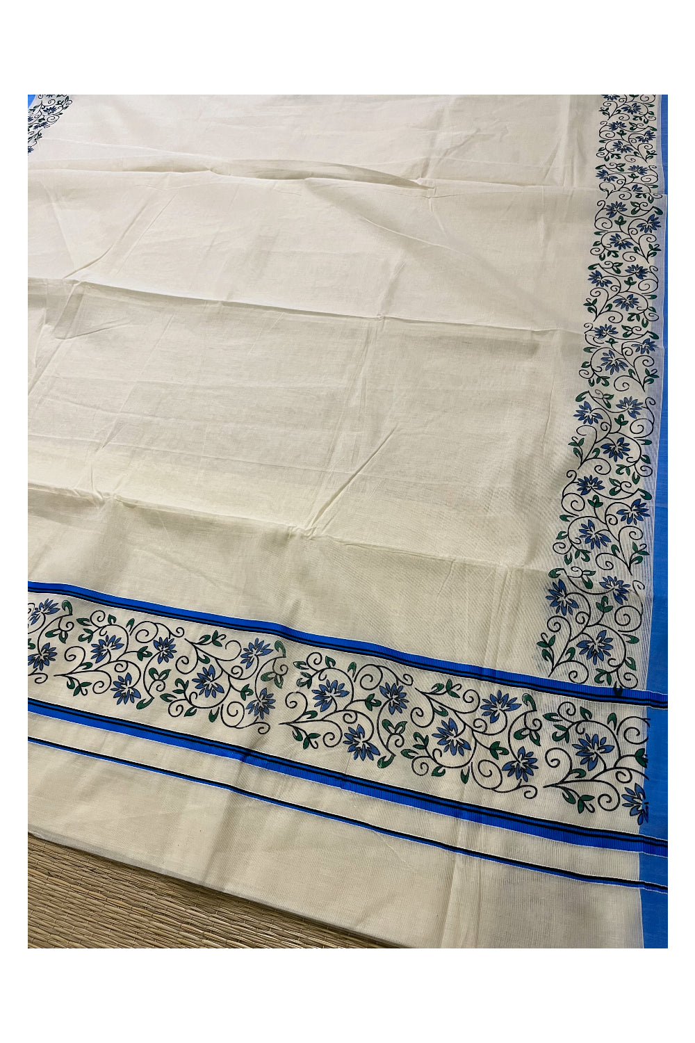 Pure Cotton Kerala Saree with Floral Block Prints and Blue Border