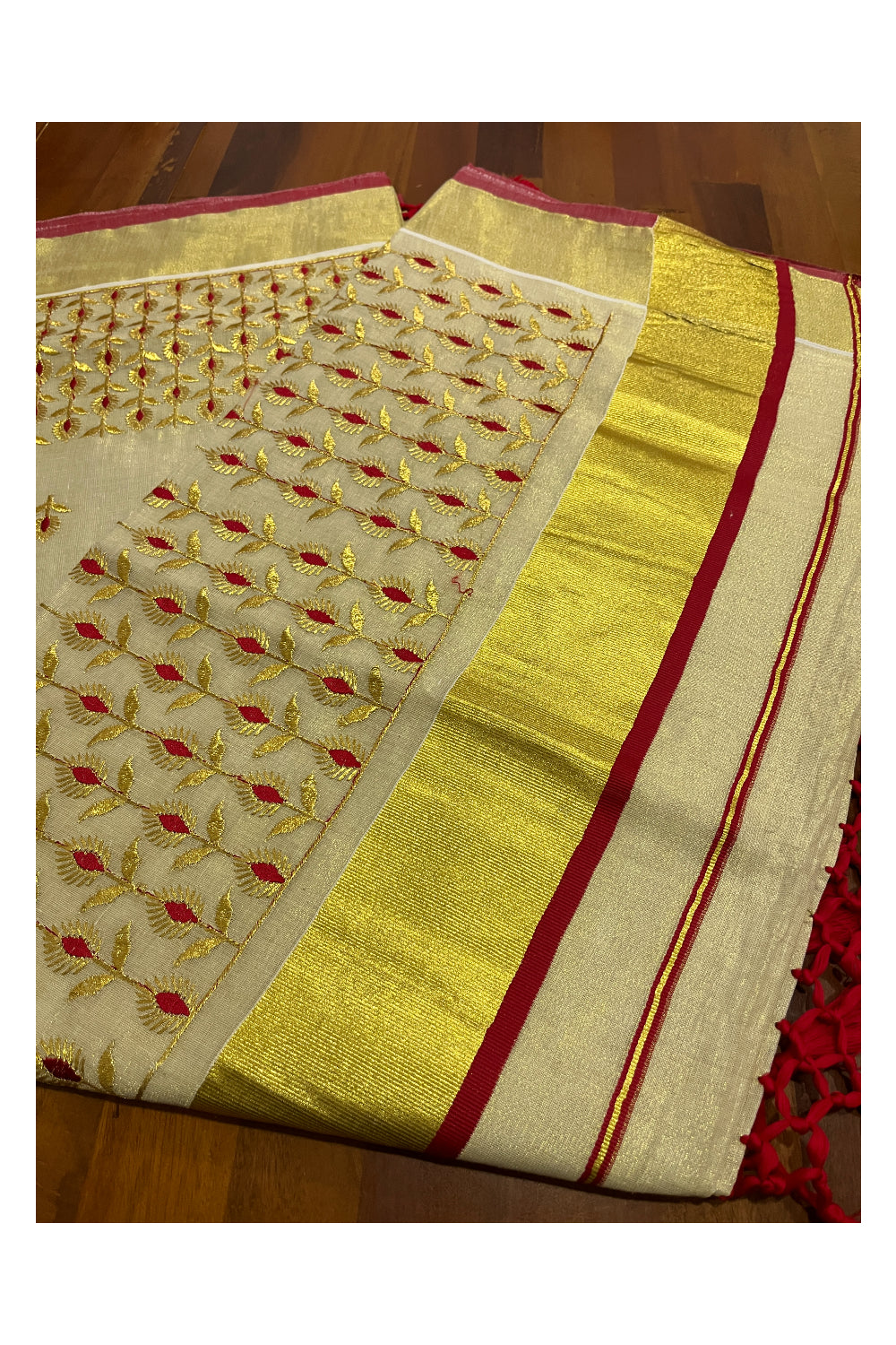 Kerala Tissue Kasavu Heavy Work Saree with Golden and Red Floral Embroidery Design