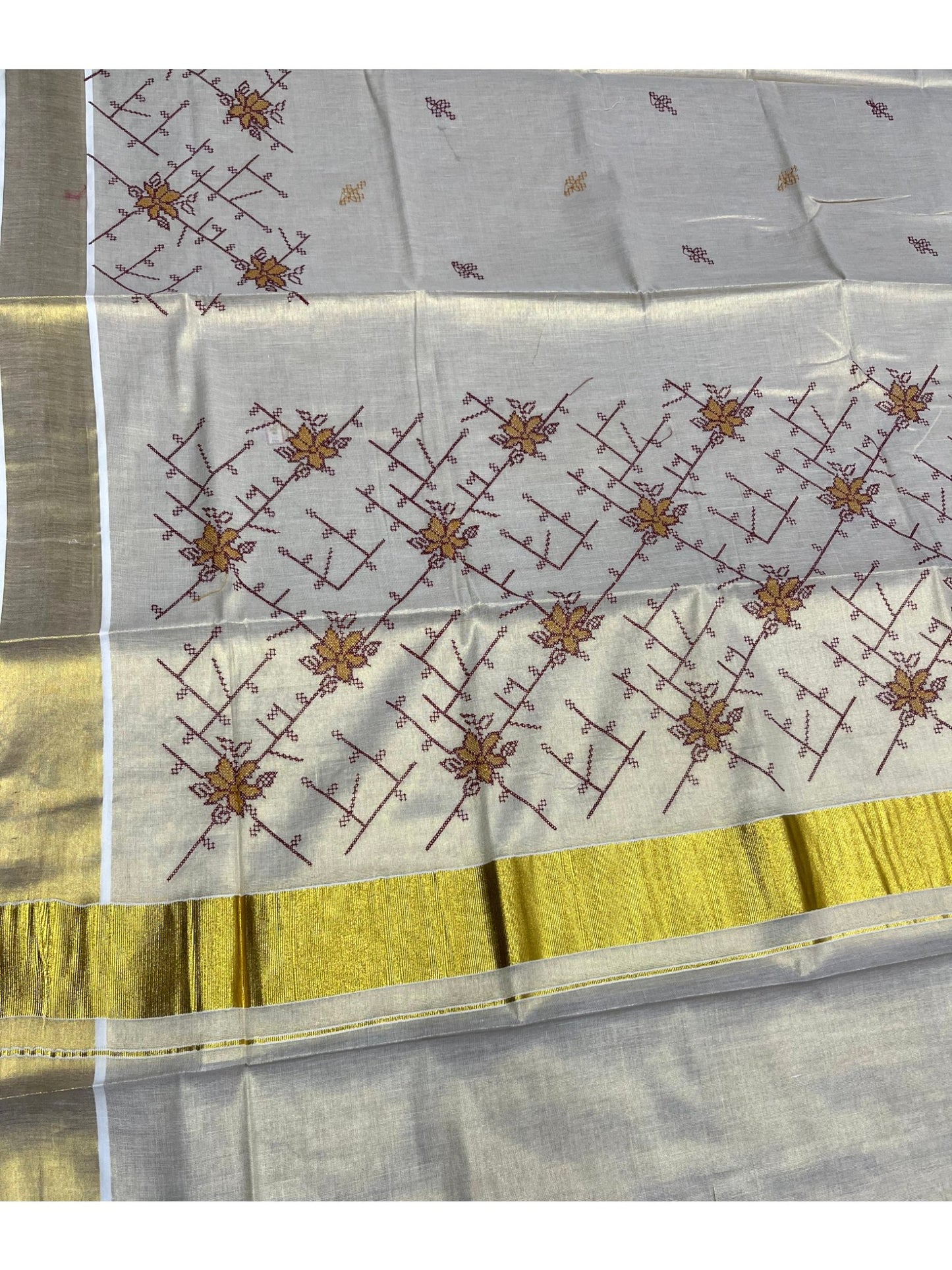 Southloom Tissue Kerala Kasavu Saree with Floral Embroidery Work on Body in Maroon