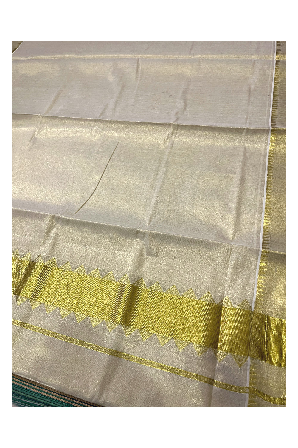 Kerala Tissue Kasavu Plain Saree With Temple Border and Pallu