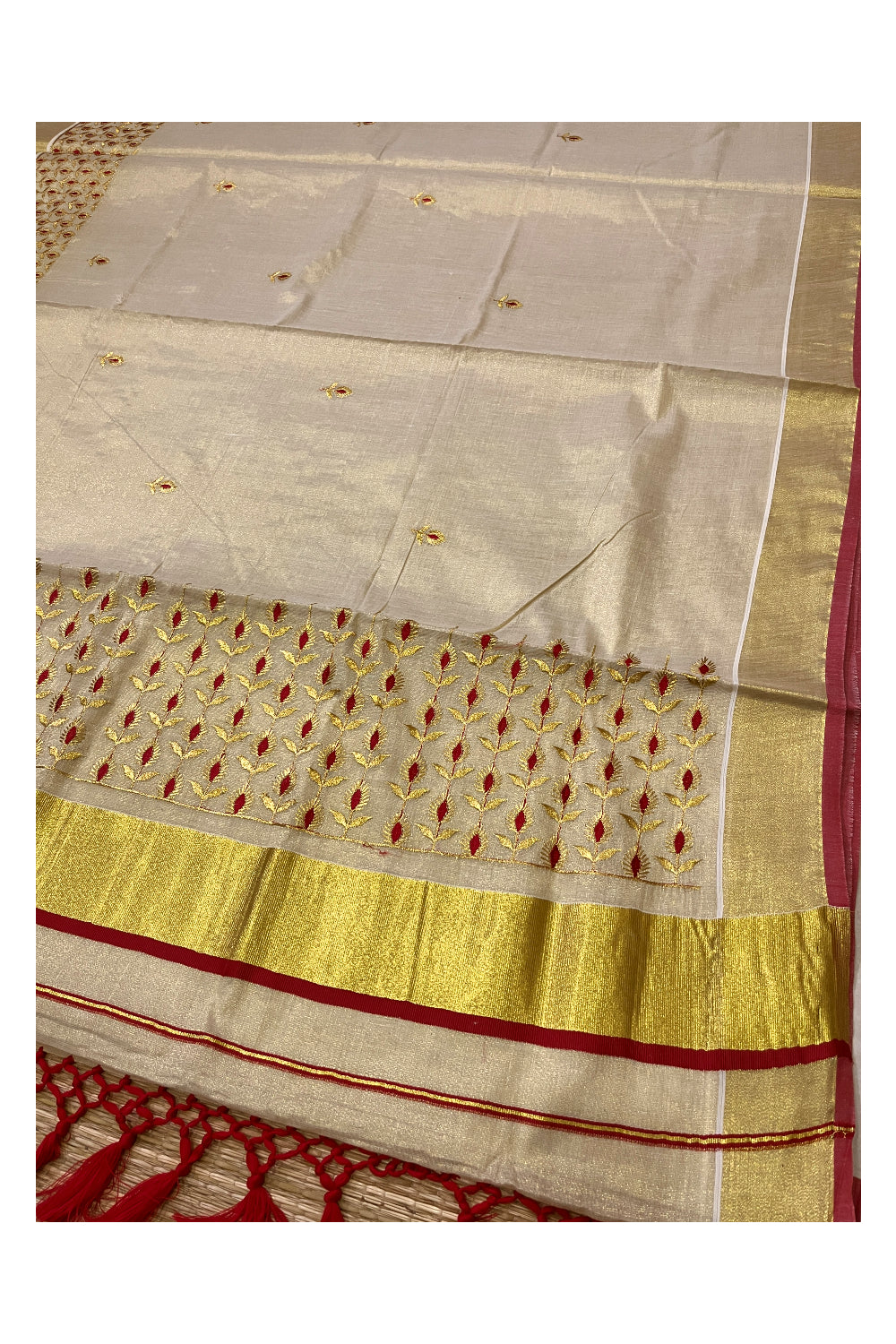 Kerala Tissue Kasavu Heavy Work Saree with Golden and Red Floral Embroidery Design