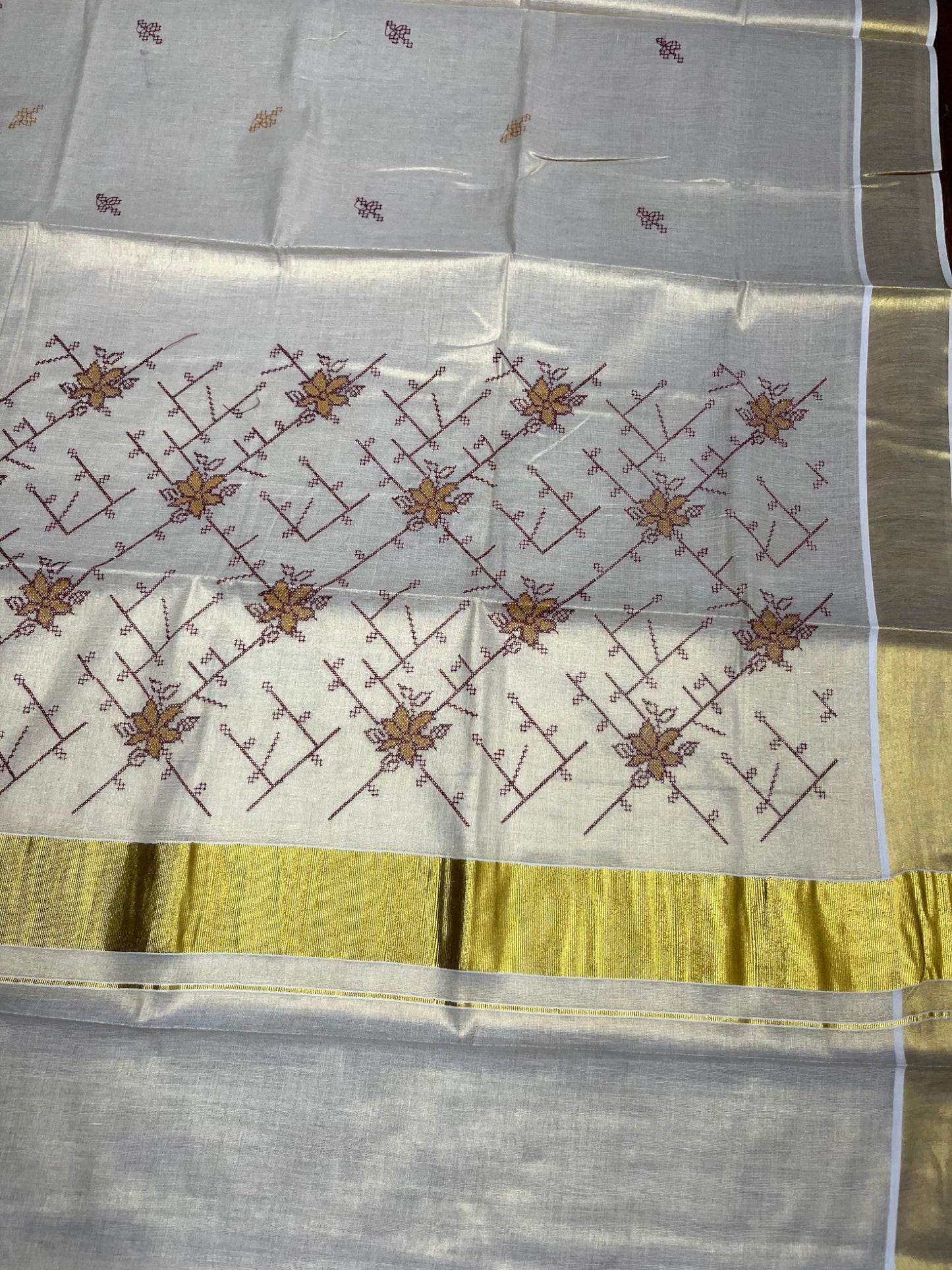 Southloom Tissue Kerala Kasavu Saree with Floral Embroidery Work on Body in Maroon
