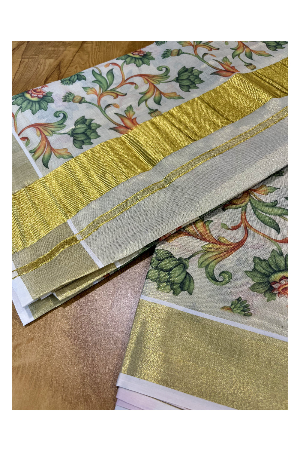 Kerala Tissue Kasavu Saree with Green Floral Kalamkari Design