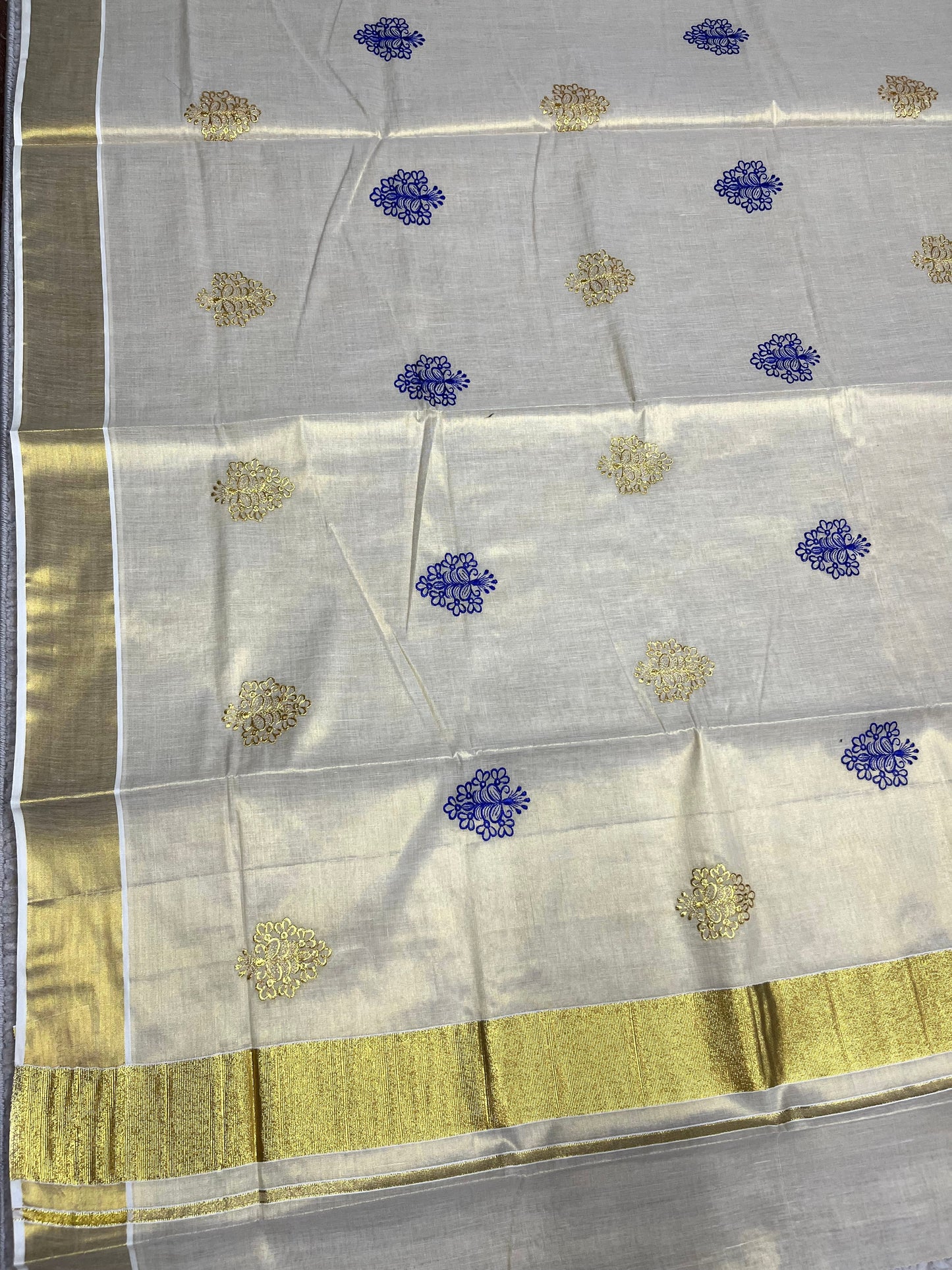 Southloom Kerala Tissue Kasavu Saree with Gold And Blue Floral Embroidery Work on Body