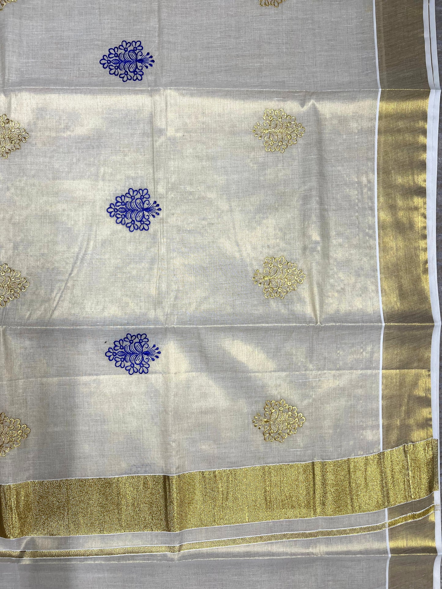 Southloom Kerala Tissue Kasavu Saree with Gold And Blue Floral Embroidery Work on Body