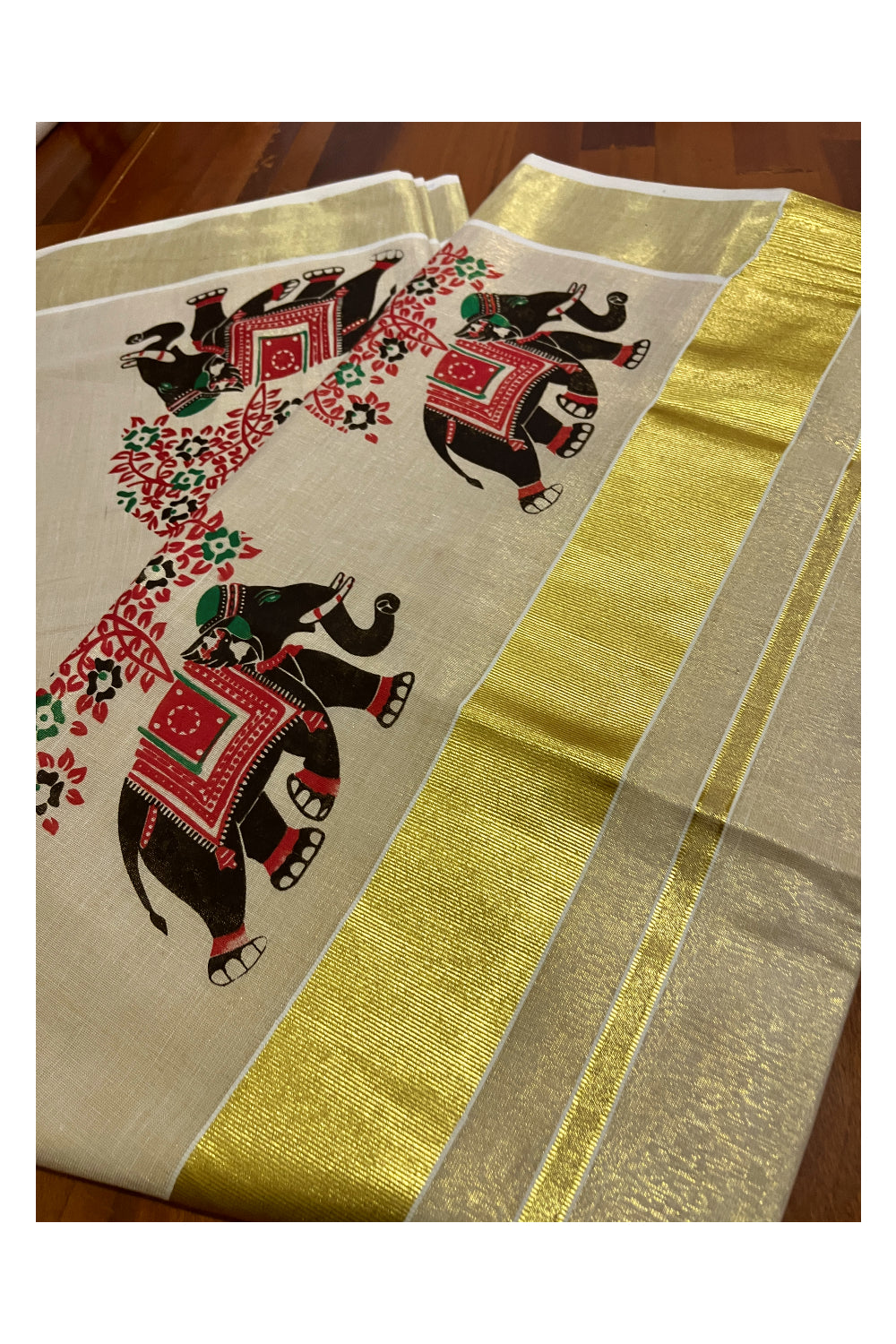 Kerala Tissue Kasavu Saree with Black and Red Elephant Mural Prints on Border and Pallu