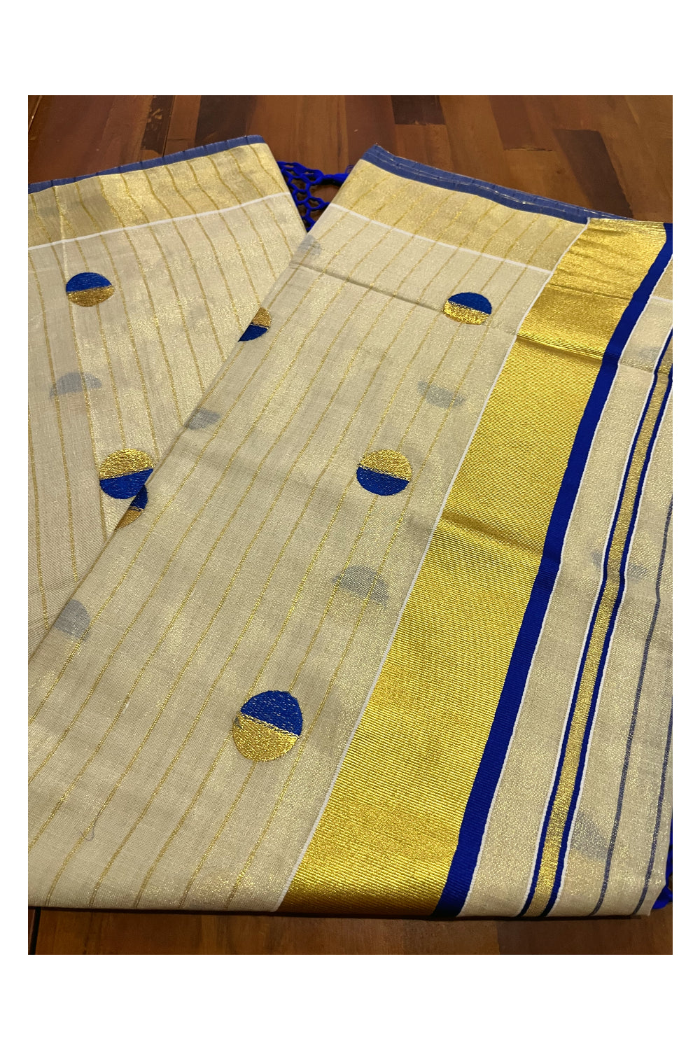 Kerala Tissue Kasavu Saree with Kasavu Lines Across Body and Blue Semi Polka Woven Designs