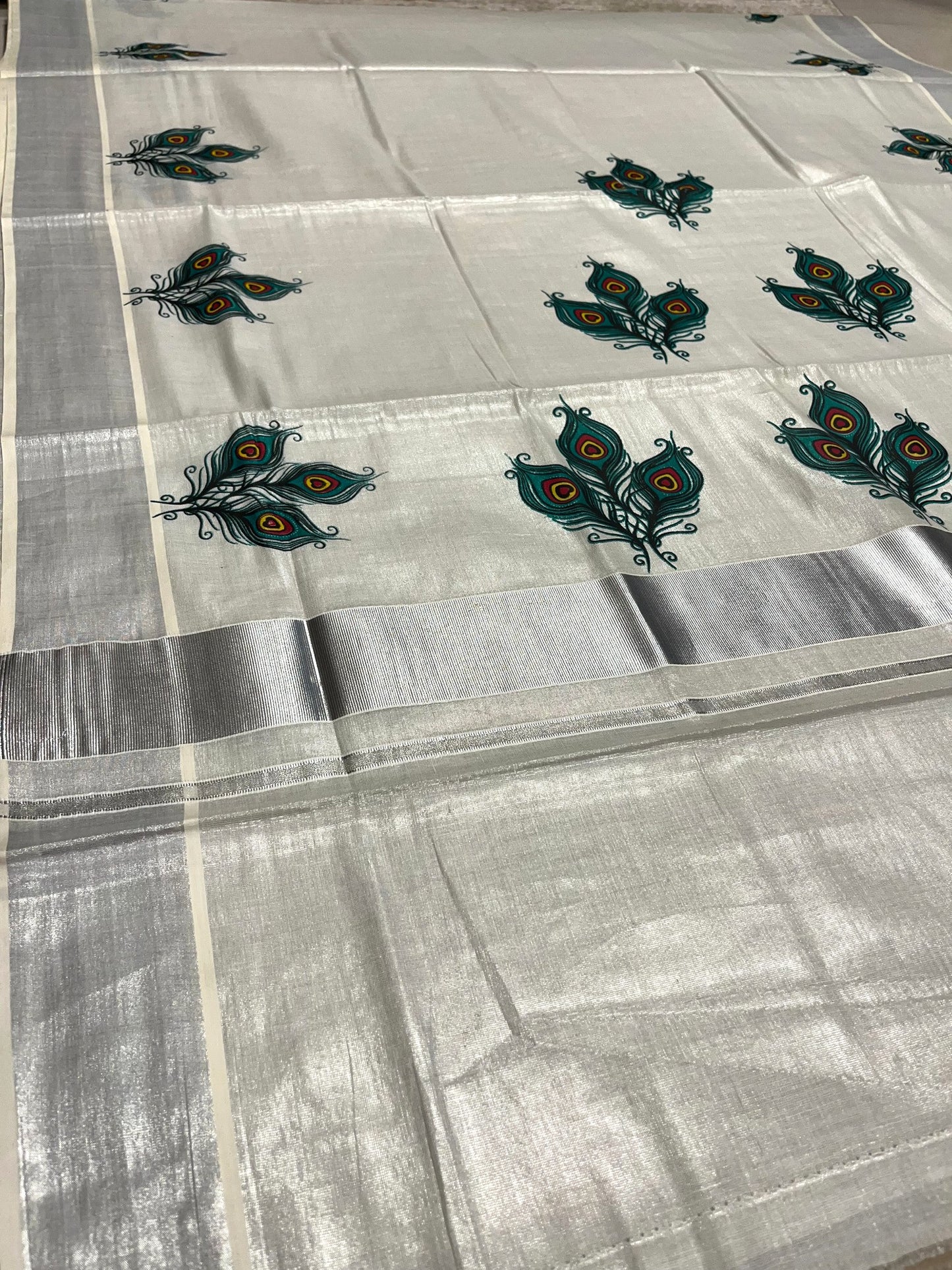 Southloom Kerala Tissue Silver Kasavu Saree with Peacock Feather Mural Print Across Body