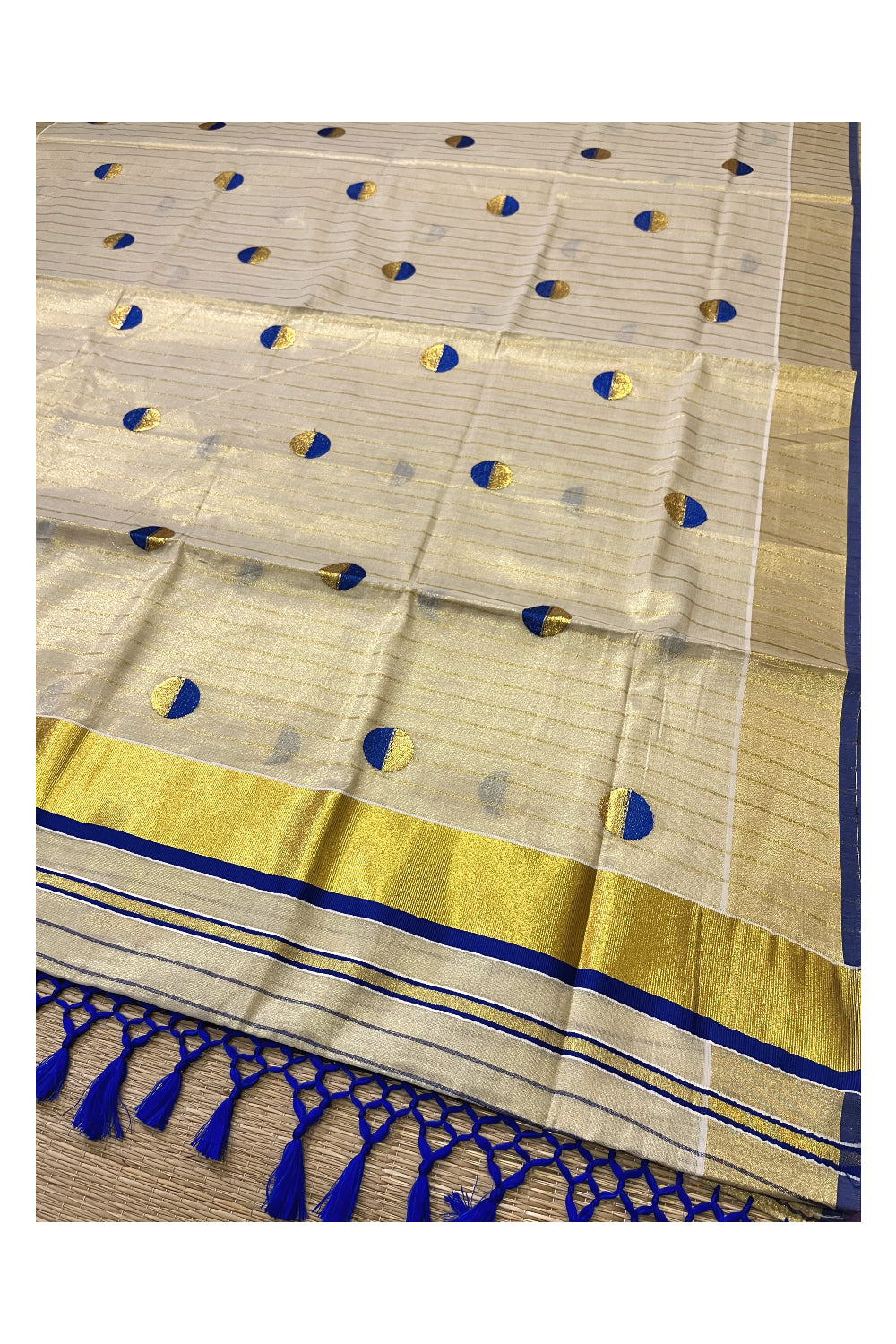 Kerala Tissue Kasavu Saree with Kasavu Lines Across Body and Blue Semi Polka Woven Designs