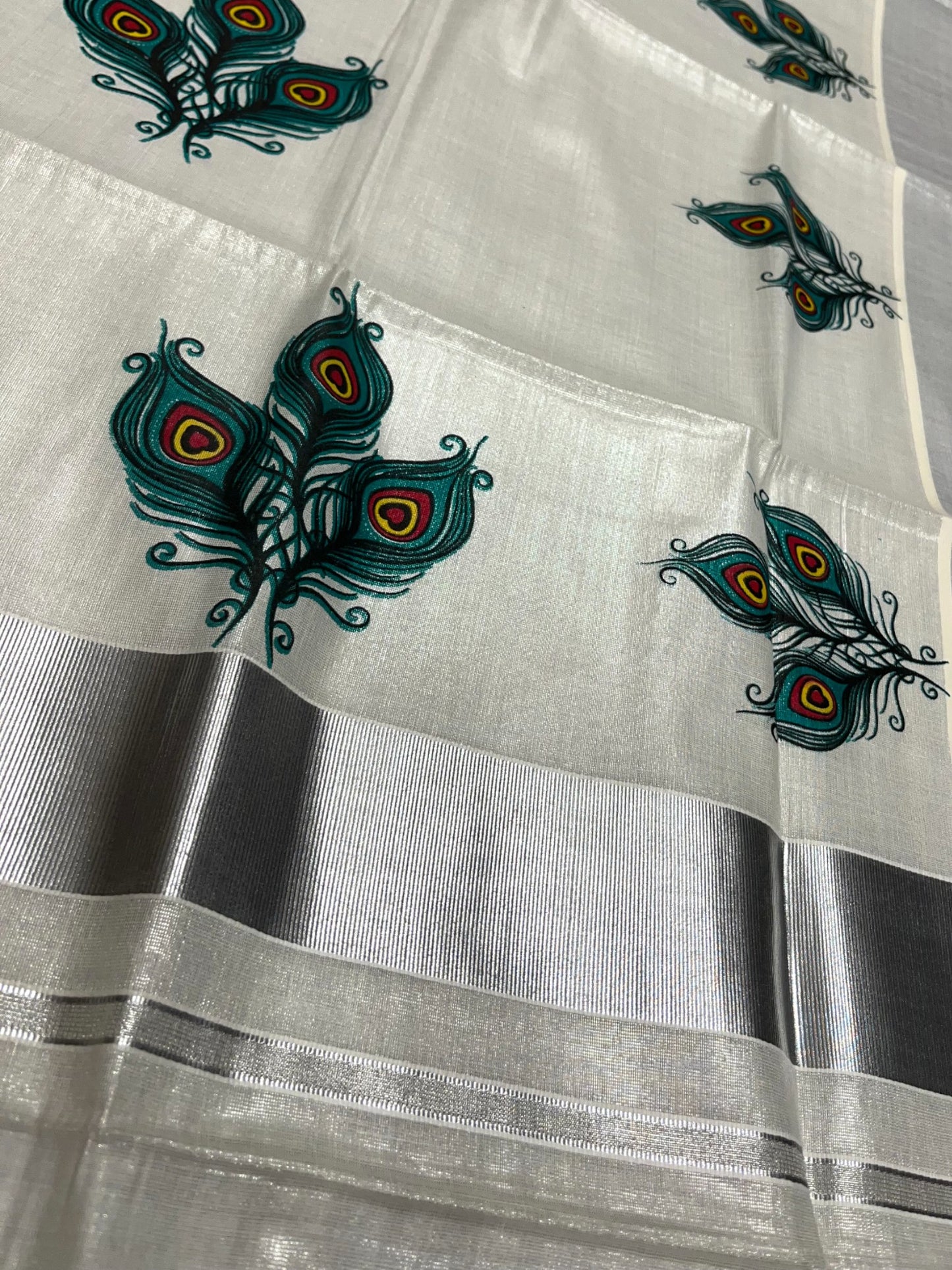 Southloom Kerala Tissue Silver Kasavu Saree with Peacock Feather Mural Print Across Body
