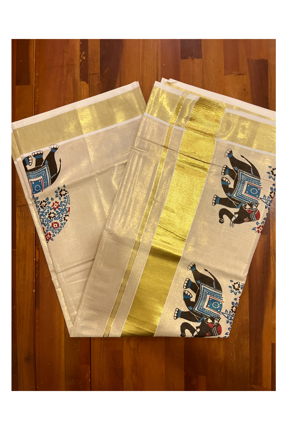 Kerala Tissue Kasavu Saree with Black and Blue Elephant Mural Prints on Border and Pallu