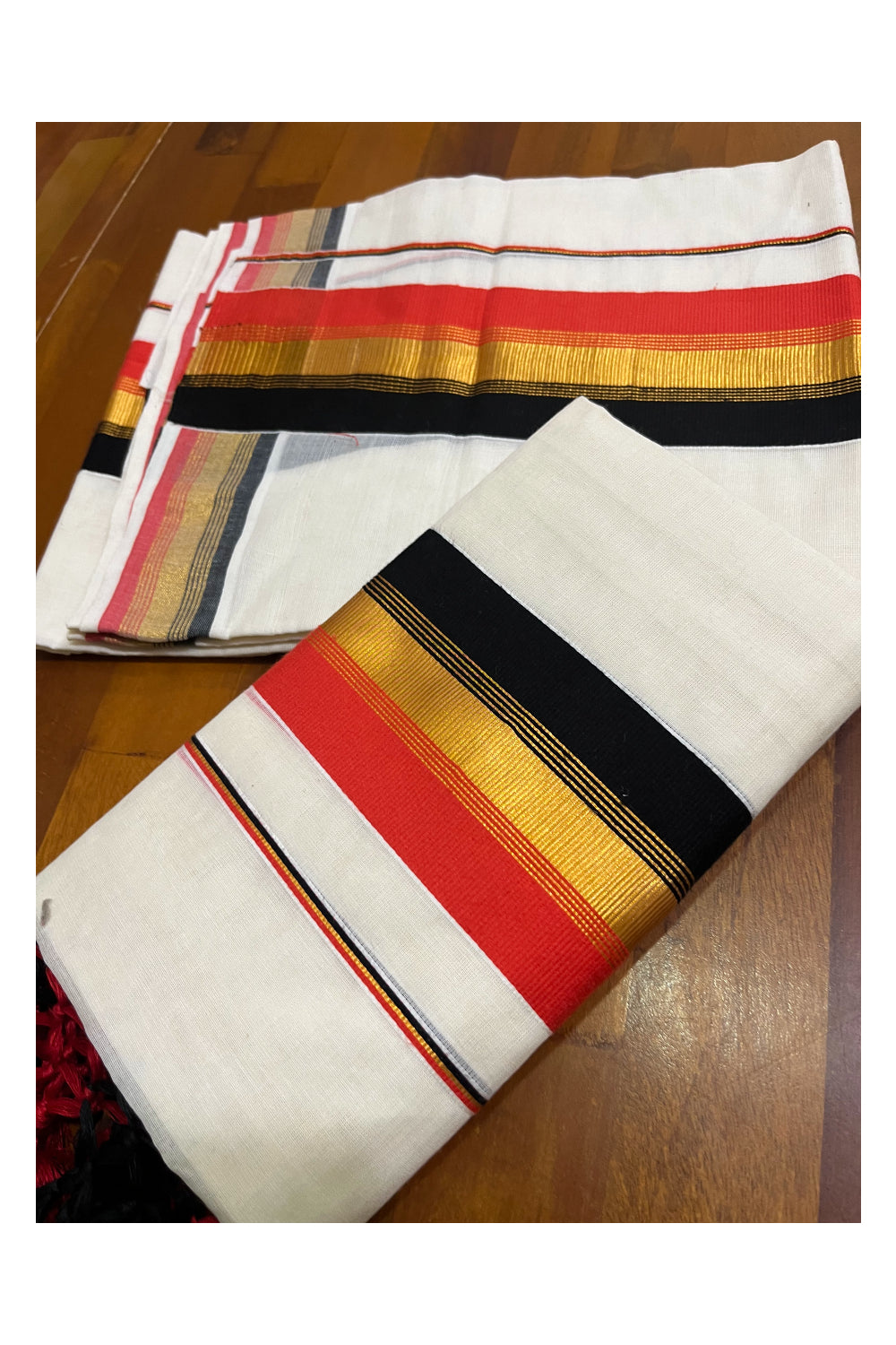 Cotton Kerala Kasavu Set Mundu (Mundum Neriyathum) with Orange and Black Border and Tassels