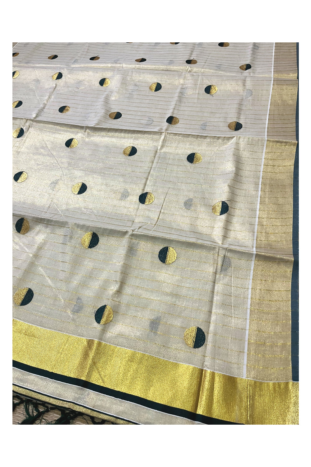 Kerala Tissue Kasavu Saree with Kasavu Lines Across Body and Dark Green Semi Polka Woven Designs