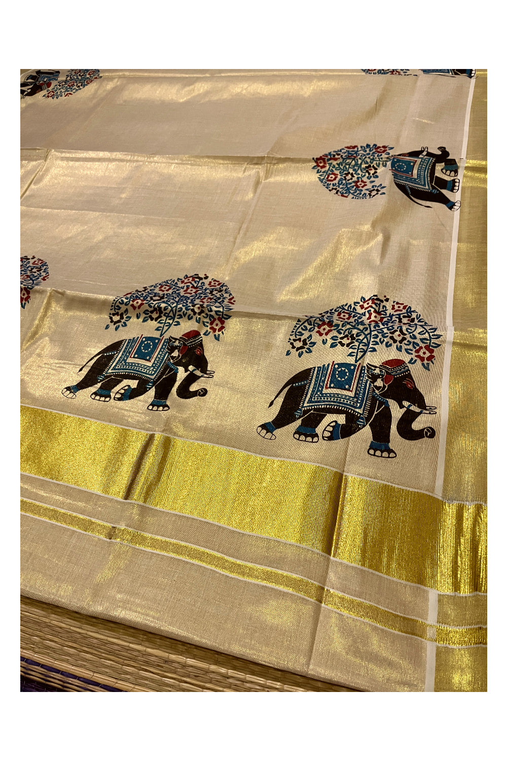 Kerala Tissue Kasavu Saree with Black and Blue Elephant Mural Prints on Border and Pallu