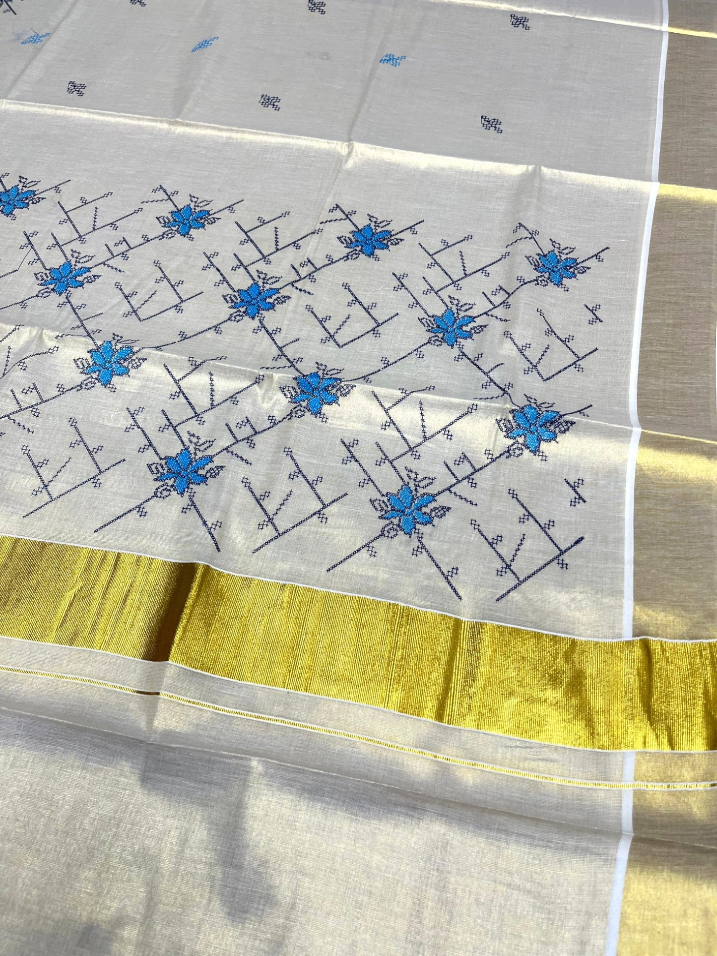Southloom Tissue Kerala Kasavu Saree with Floral Embroidery Work on Body in Blue