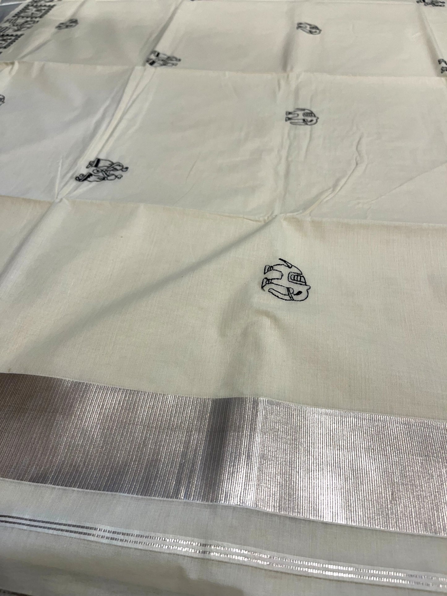 Kerala Cotton Silver Kasavu Saree With Mural Festival Parasol Plain And Black Elephant Design And Embroidery Work