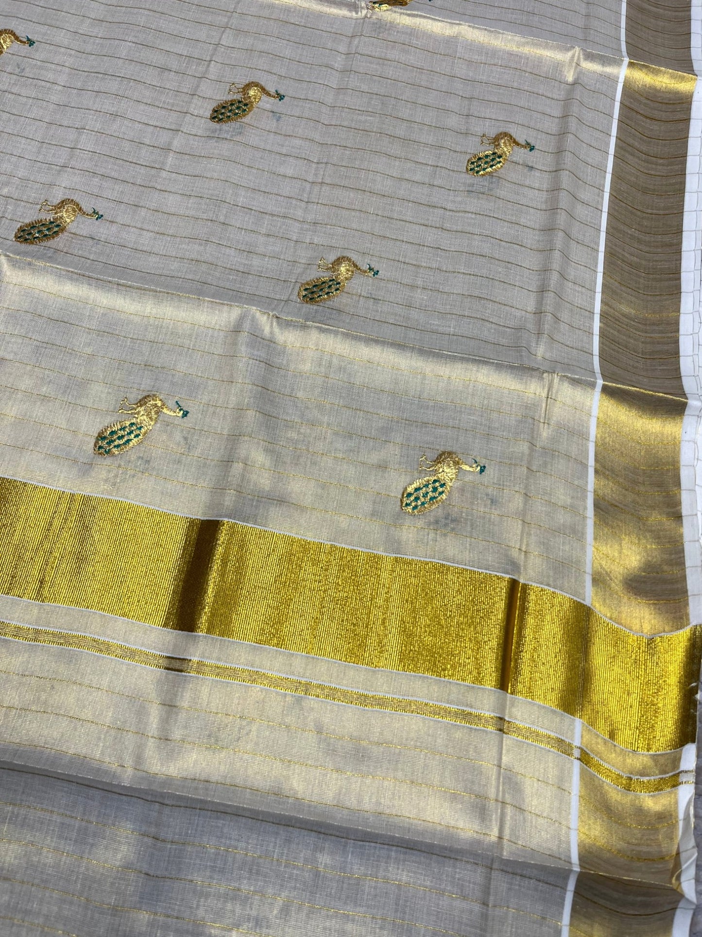 Southloom Tissue Kerala Kasavu Lines Saree with Peacock Embroidery Work on Body in Peacock Green