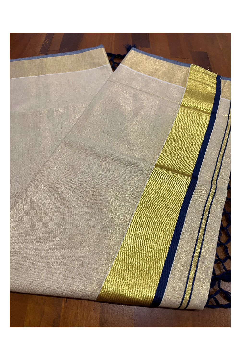 Kerala Kasavu Tissue Saree with Blue Narrow Border and Tassels