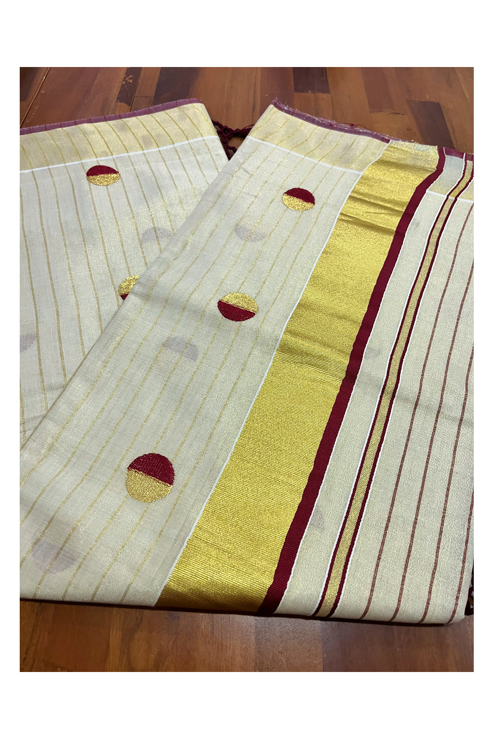 Kerala Tissue Kasavu Saree with Kasavu Lines Across Body and Maroon Semi Polka Woven Designs