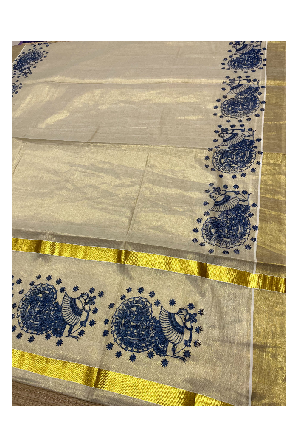 Kerala Tissue Kasavu Saree with Blue Peacock Block Printed Designs