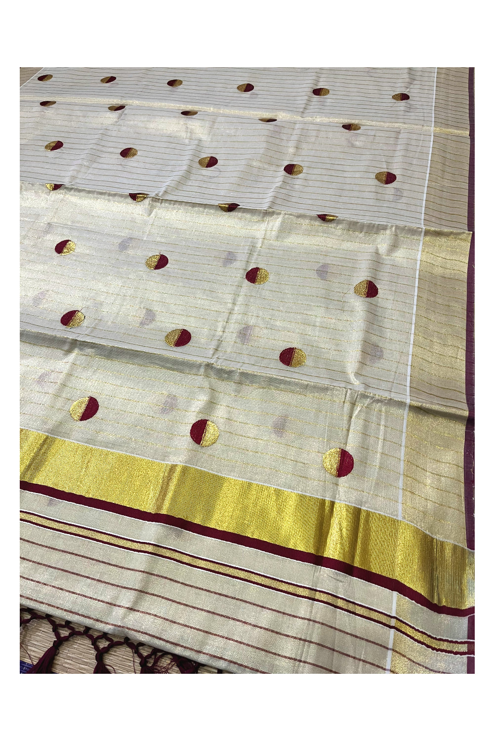 Kerala Tissue Kasavu Saree with Kasavu Lines Across Body and Maroon Semi Polka Woven Designs