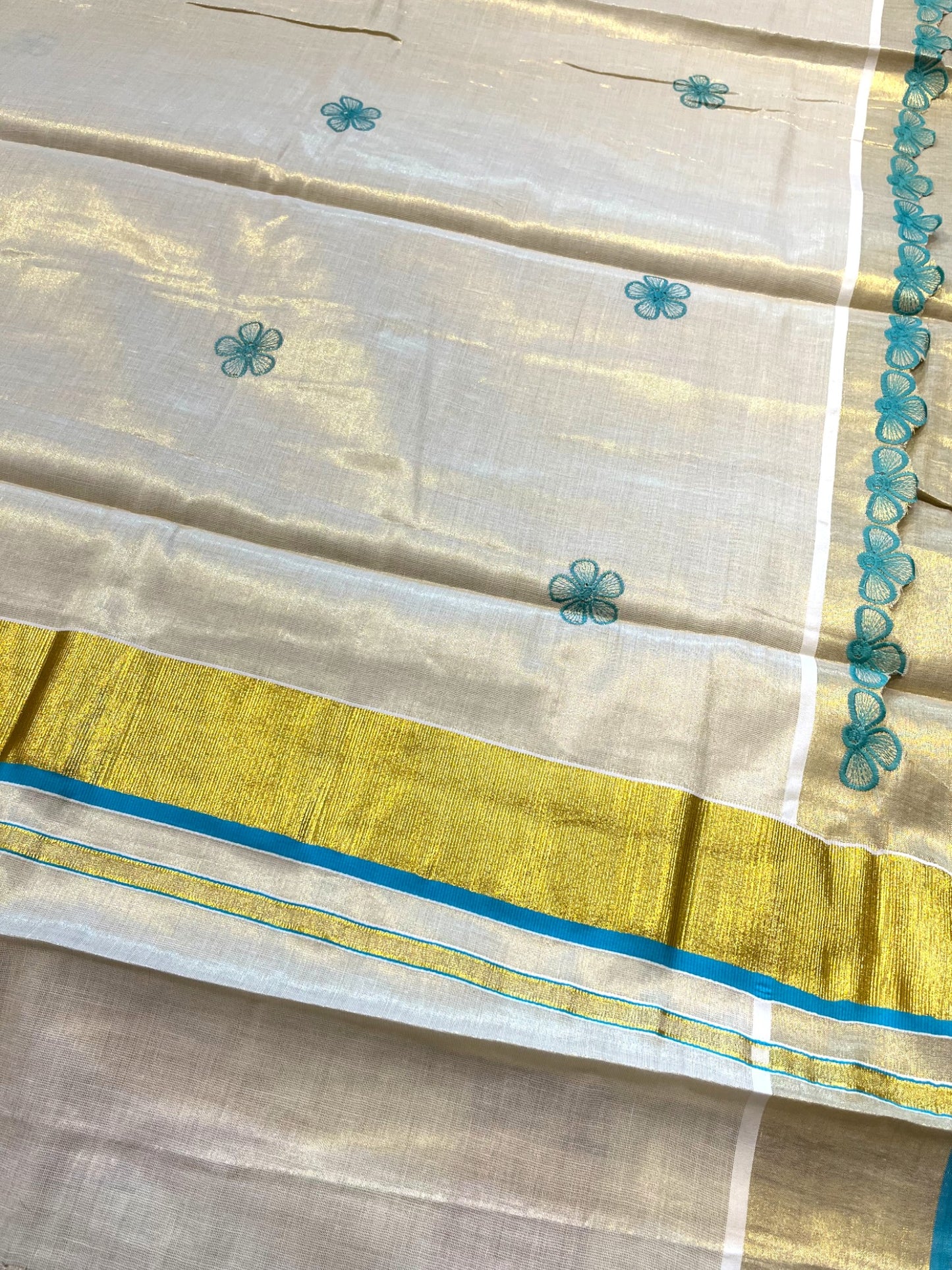 Southloom Kerala Tissue Kasavu Saree with Turquoise Floral Embroidery on Body and Border