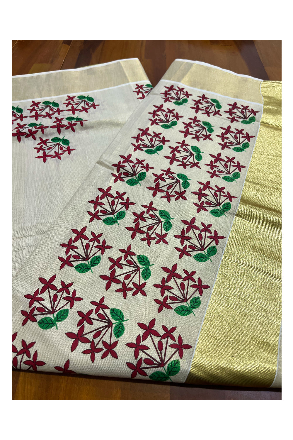 Kerala Tissue Kasavu Saree with Maroon Floral Prints on Body and Kasavu Border