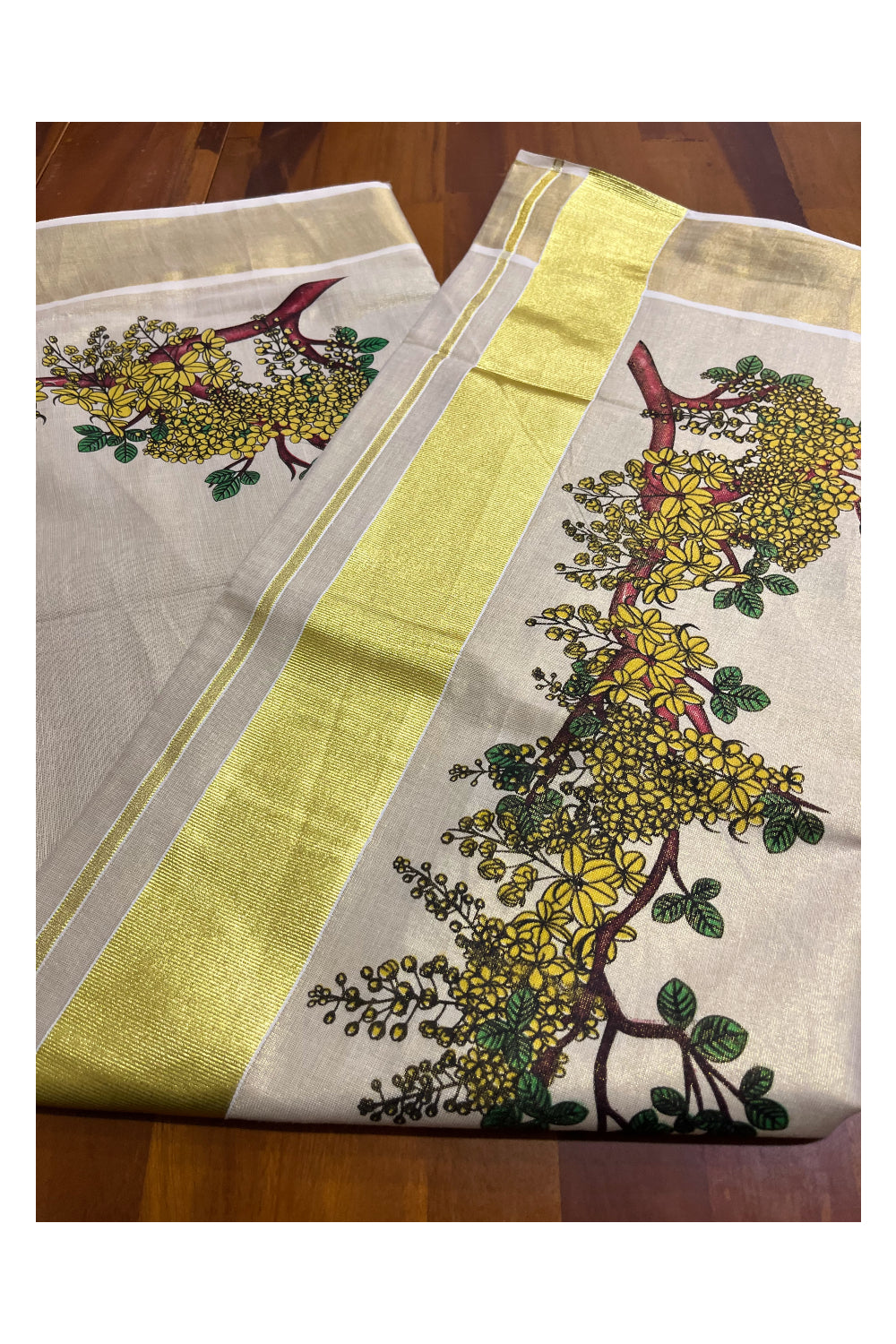 Kerala Tissue Kasavu Saree with Kanikonna Floral Prints on Body and Kasavu Border