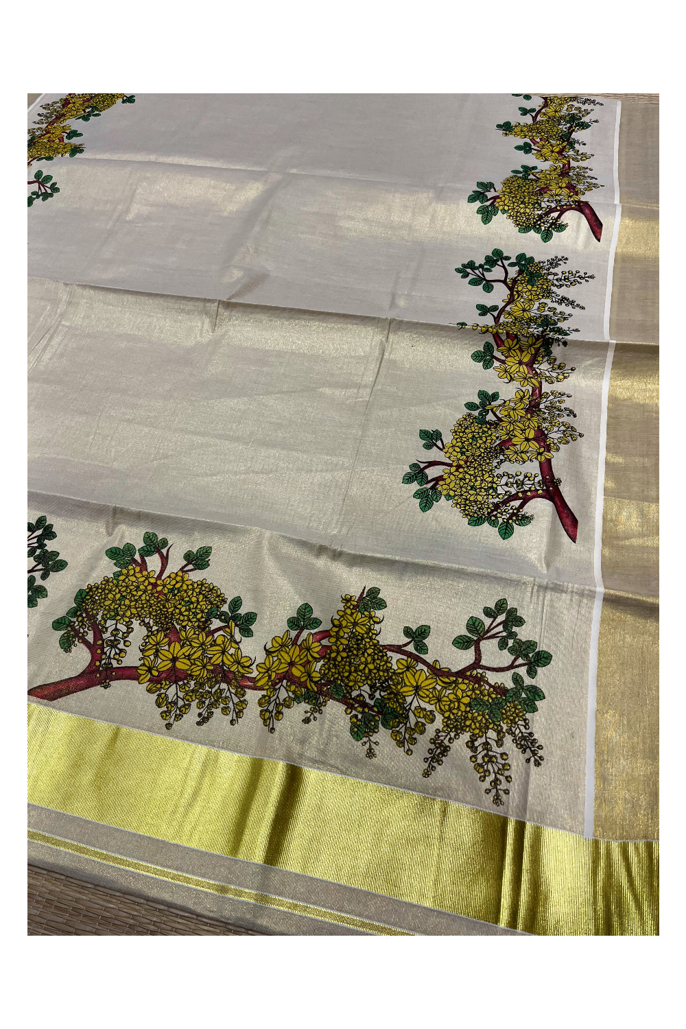 Kerala Tissue Kasavu Saree with Kanikonna Floral Prints on Body and Kasavu Border