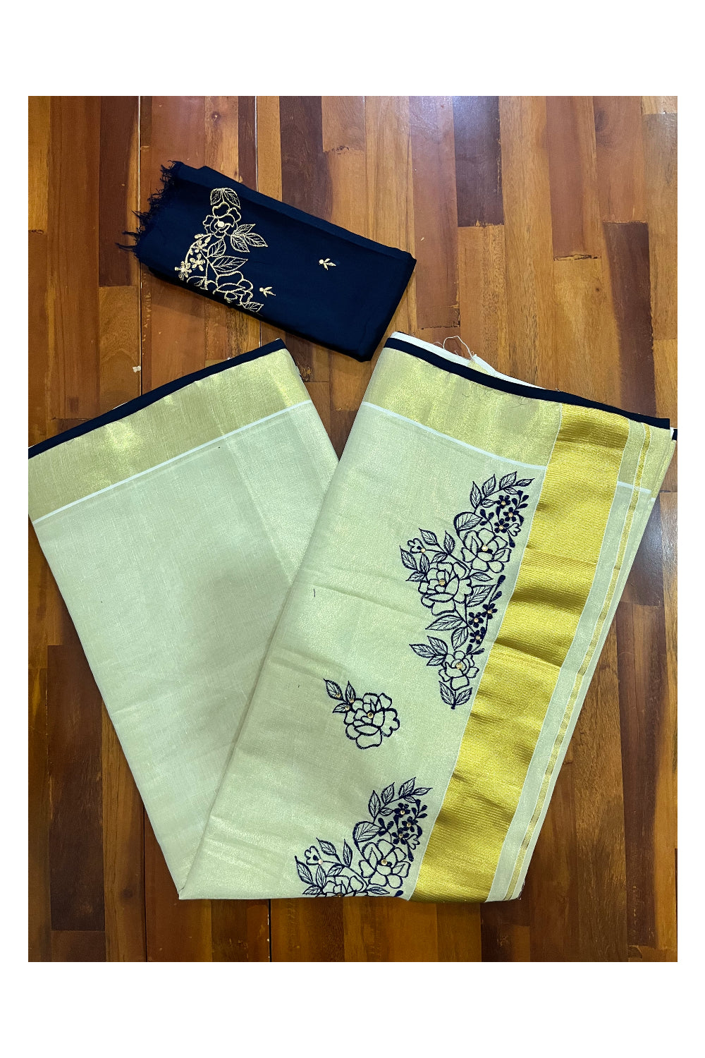 Kerala Tissue Kasavu Saree with Floral Embroidery Works on Body and Navy Blue Blouse Piece