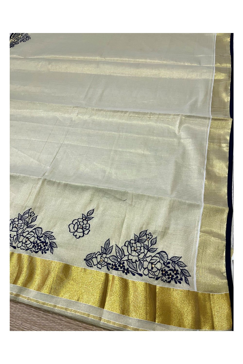 Kerala Tissue Kasavu Saree with Floral Embroidery Works on Body and Navy Blue Blouse Piece