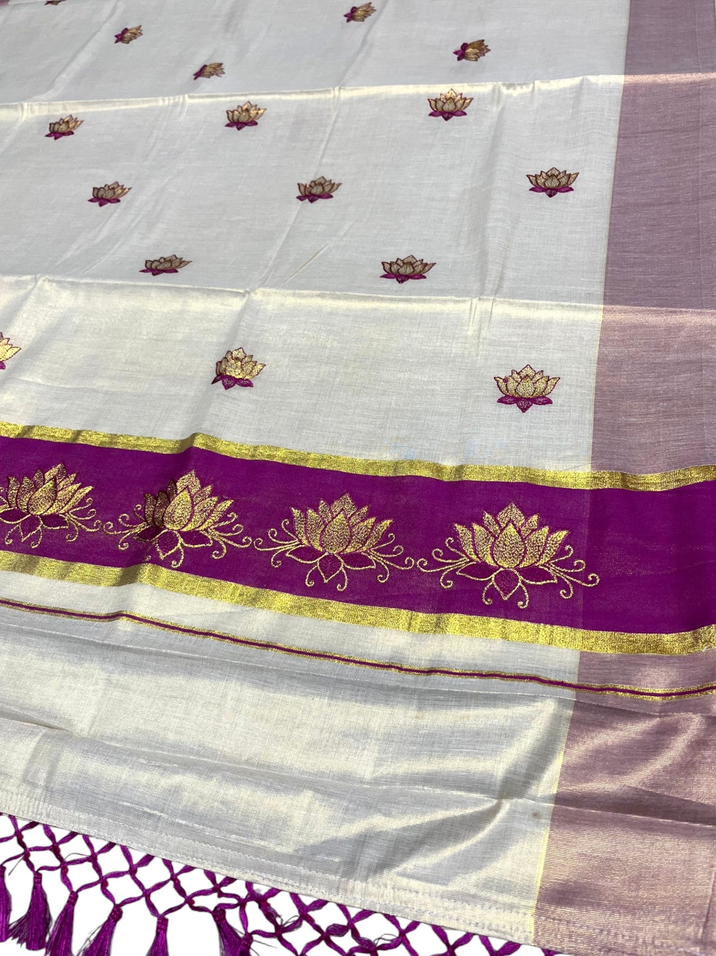 Southloom Kerala Tissue Kasavu Saree with Magenta And Golden Lotus Embroidary Designs on Body SL273