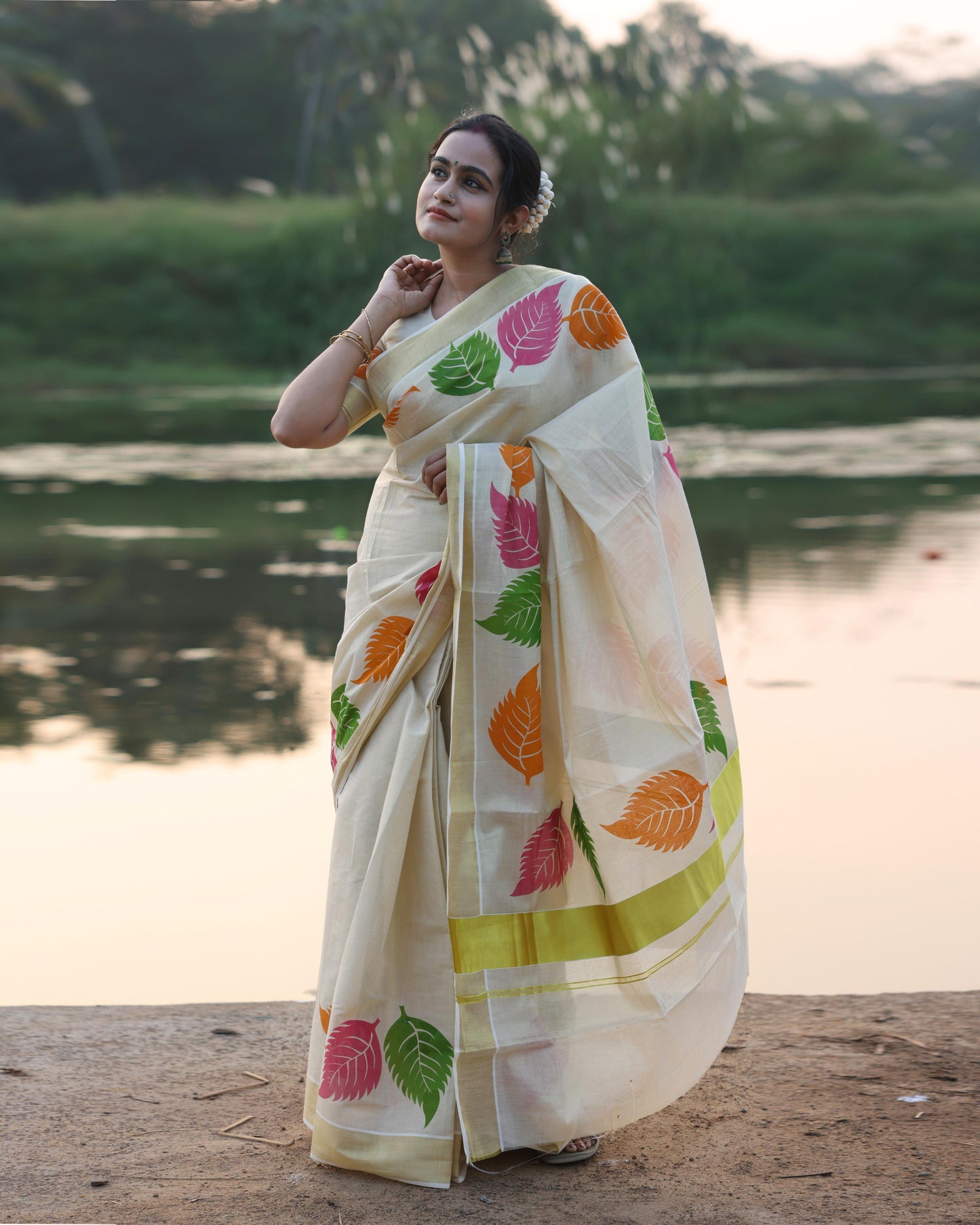 Kerala Tissue Saree with Vibrant Colour Big Leaf Designs on Border