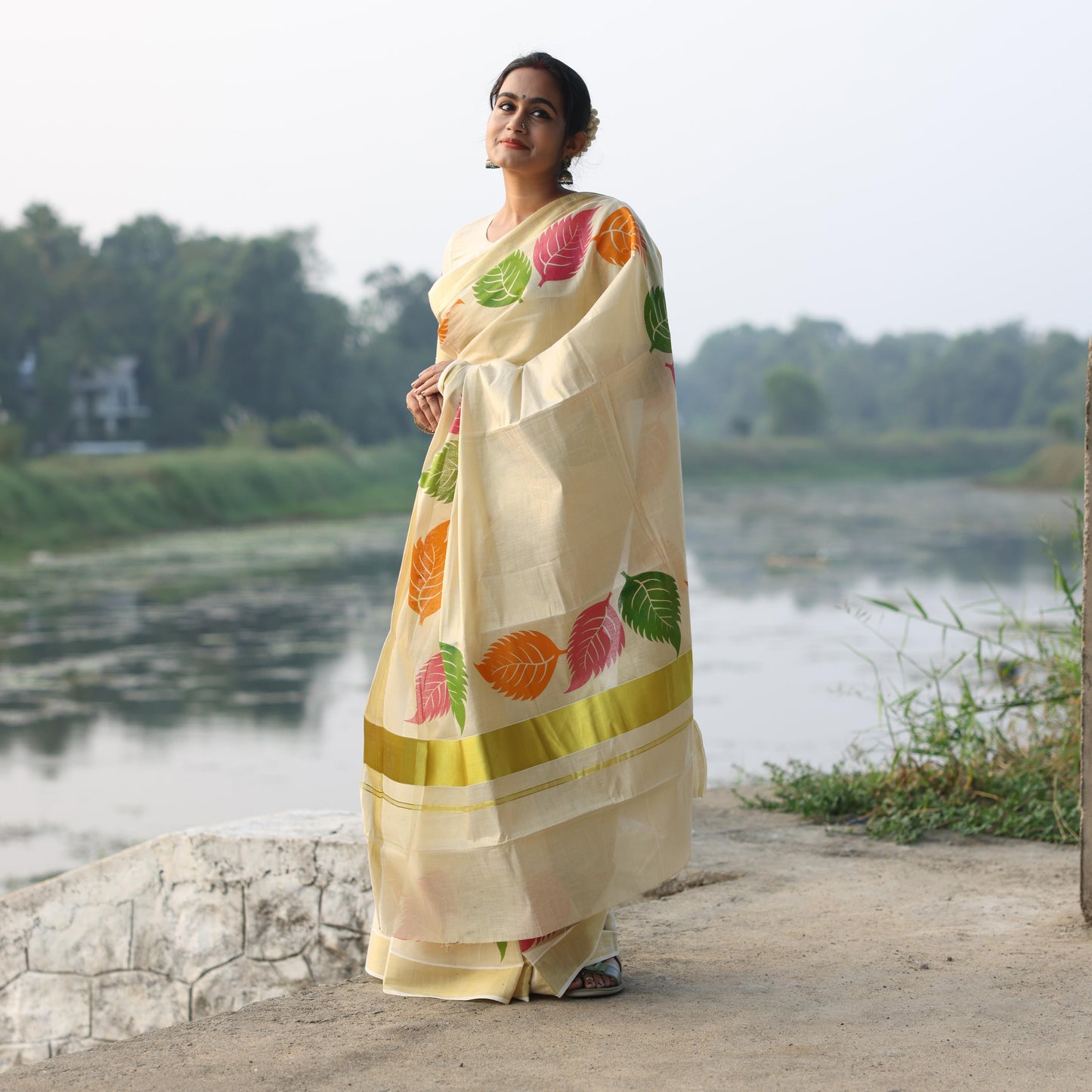 Kerala Tissue Saree with Vibrant Colour Big Leaf Designs on Border