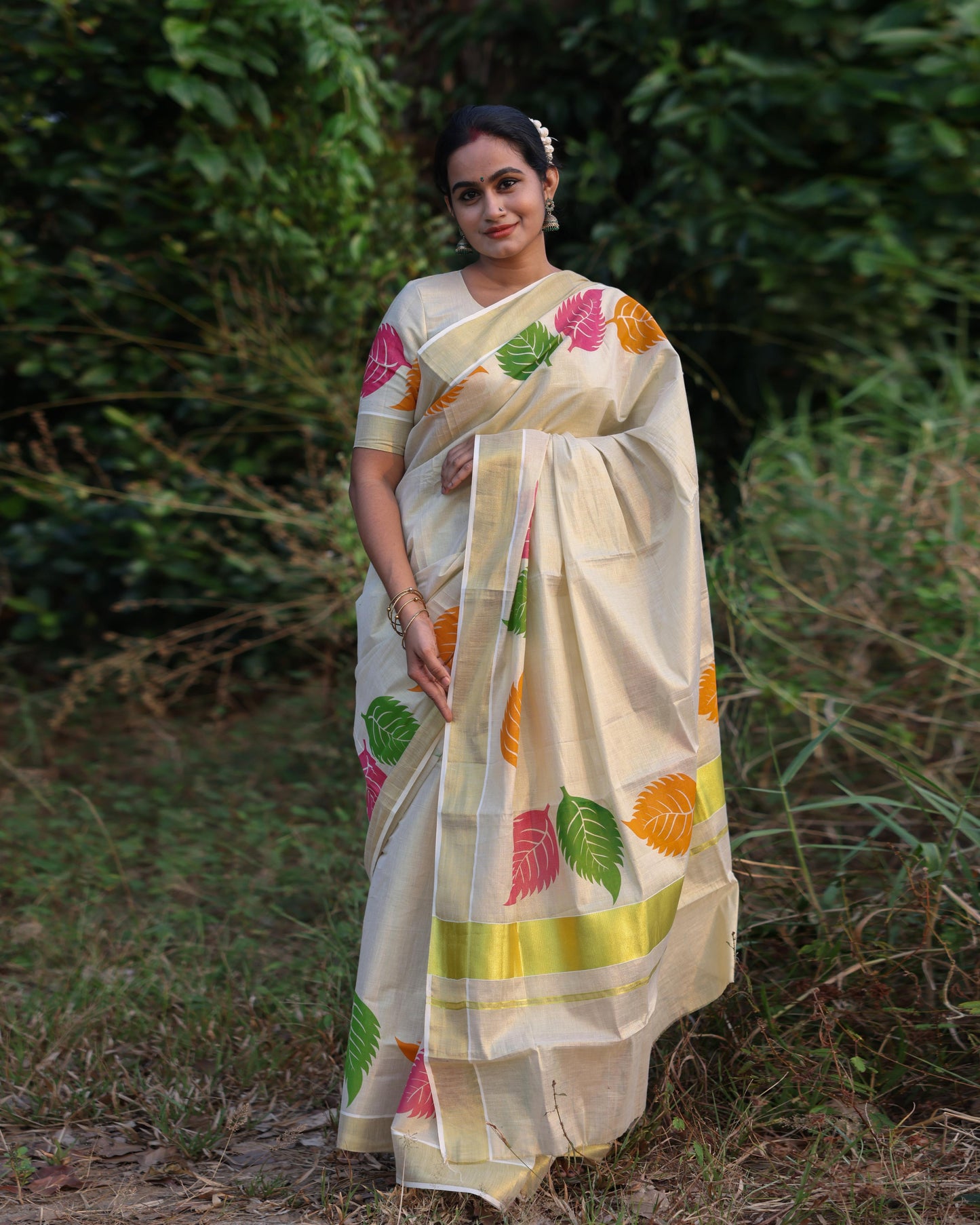 Kerala Tissue Saree with Vibrant Colour Big Leaf Designs on Border