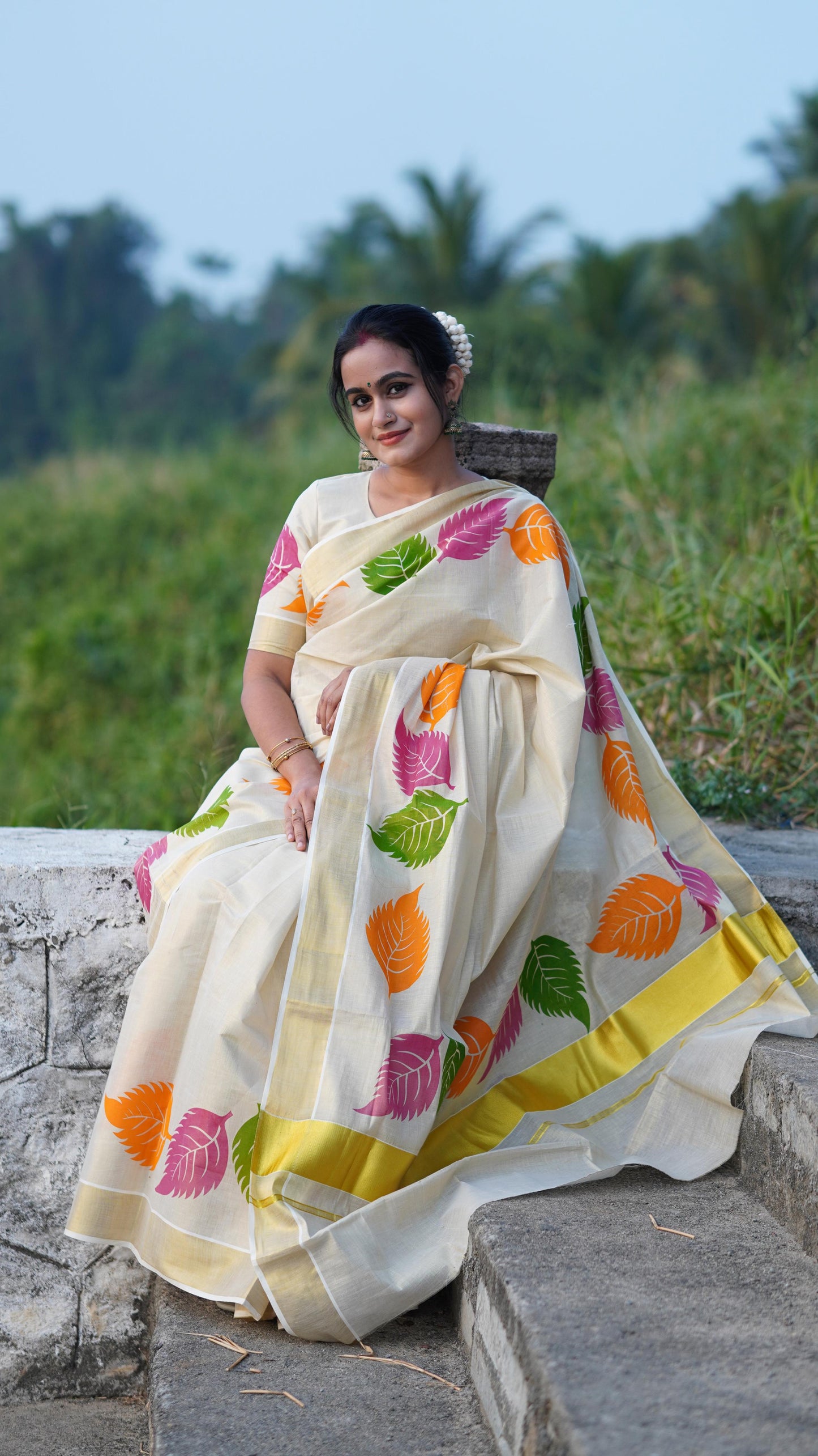 Kerala Tissue Saree with Vibrant Colour Big Leaf Designs on Border