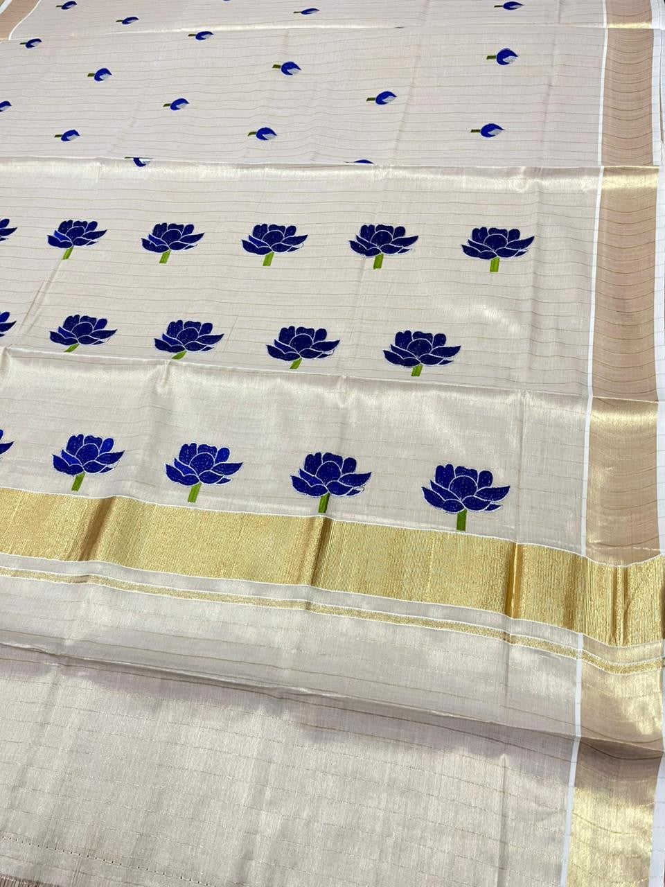 Southloom Kerala Tissue Kasavu Lines Saree with Blue Floral Embroidery Design on Body
