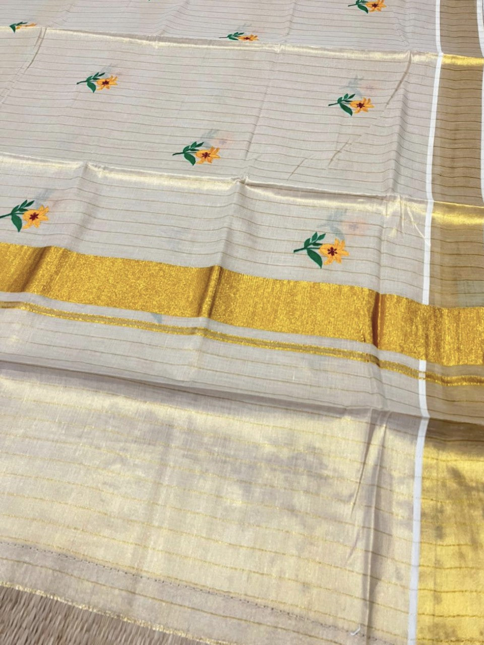 Southloom Kerala Tissue Yellow And Green Floral Embroidery Design on the Body With Gold Kasavu