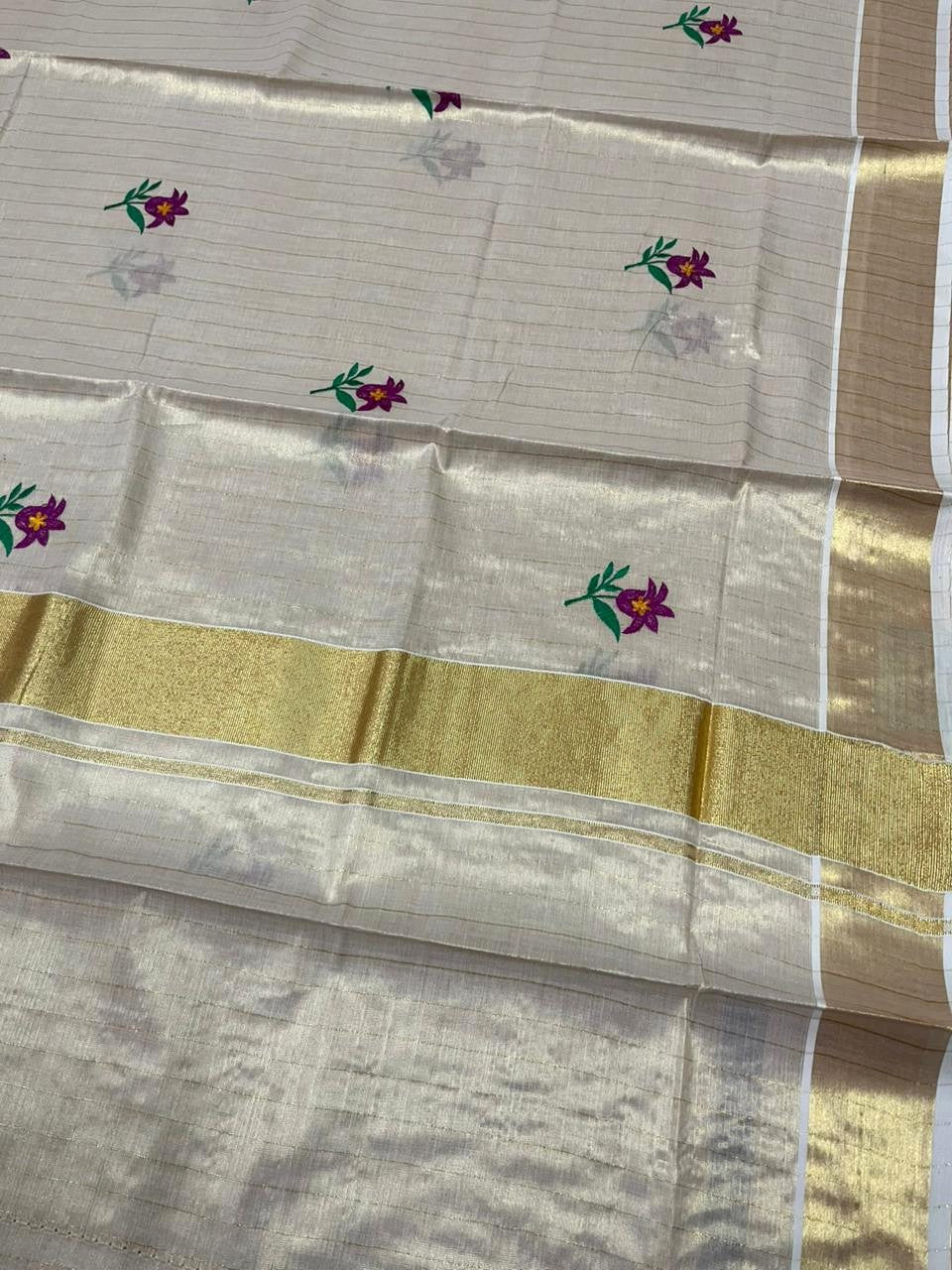 Southloom Kerala Tissue Violet And Green Floral Embroidery Design on the Body With Gold Kasavu