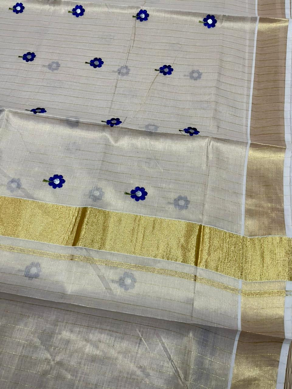 Southloom Kerala Tissue Blue Floral Embroidery Design on the Body With Gold Kasavu