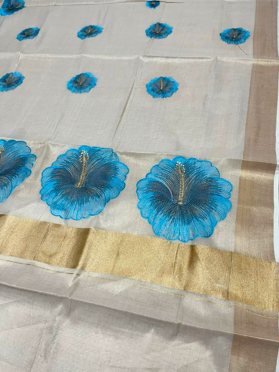 Southloom Kerala Tissue Kasavu Saree with Blue Floral Embroidery Design on Body SL434