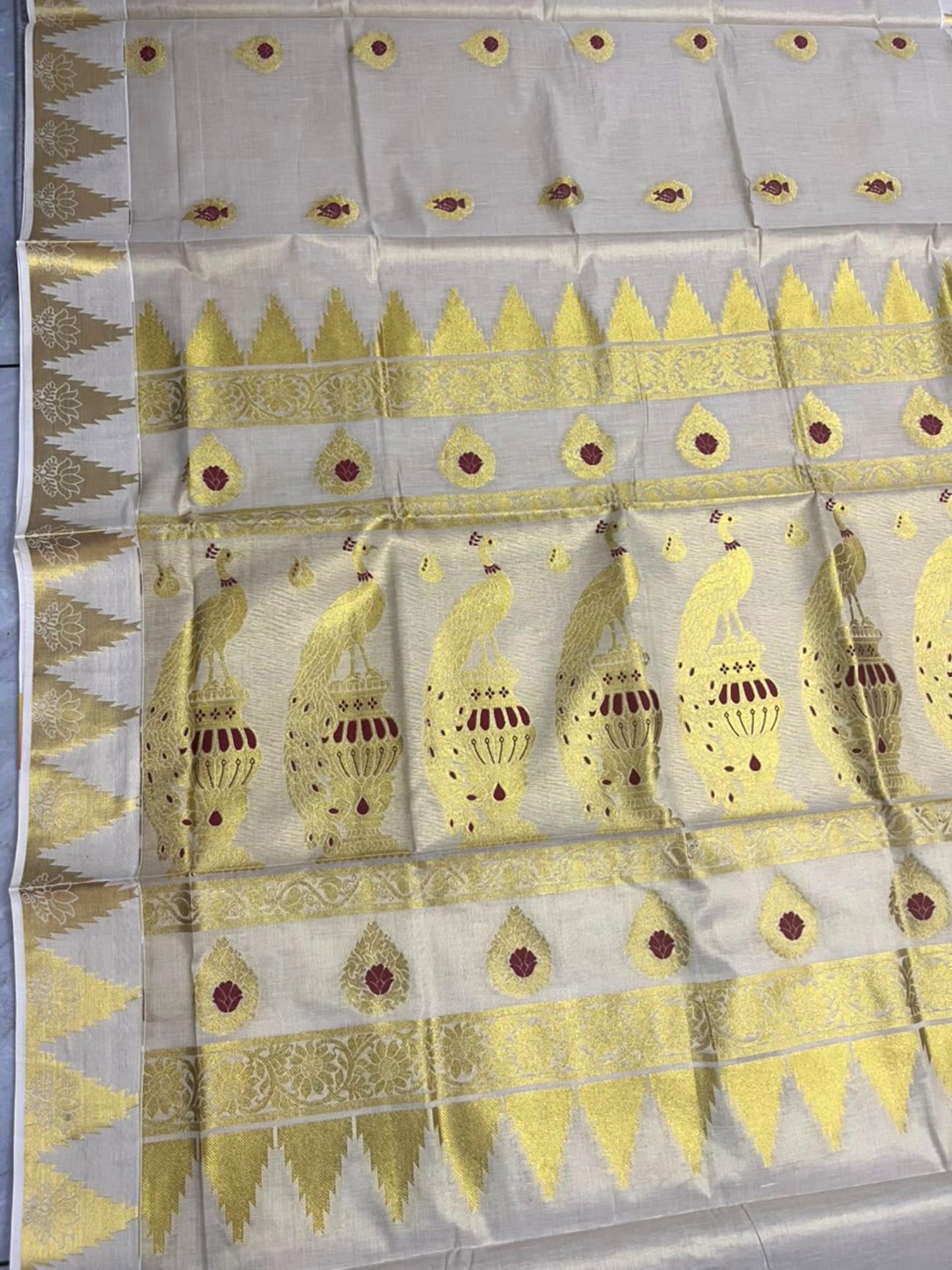 Southloom Tissue Kerala Kasavu Heavy Work Saree with Peacock Woven Design on Borders