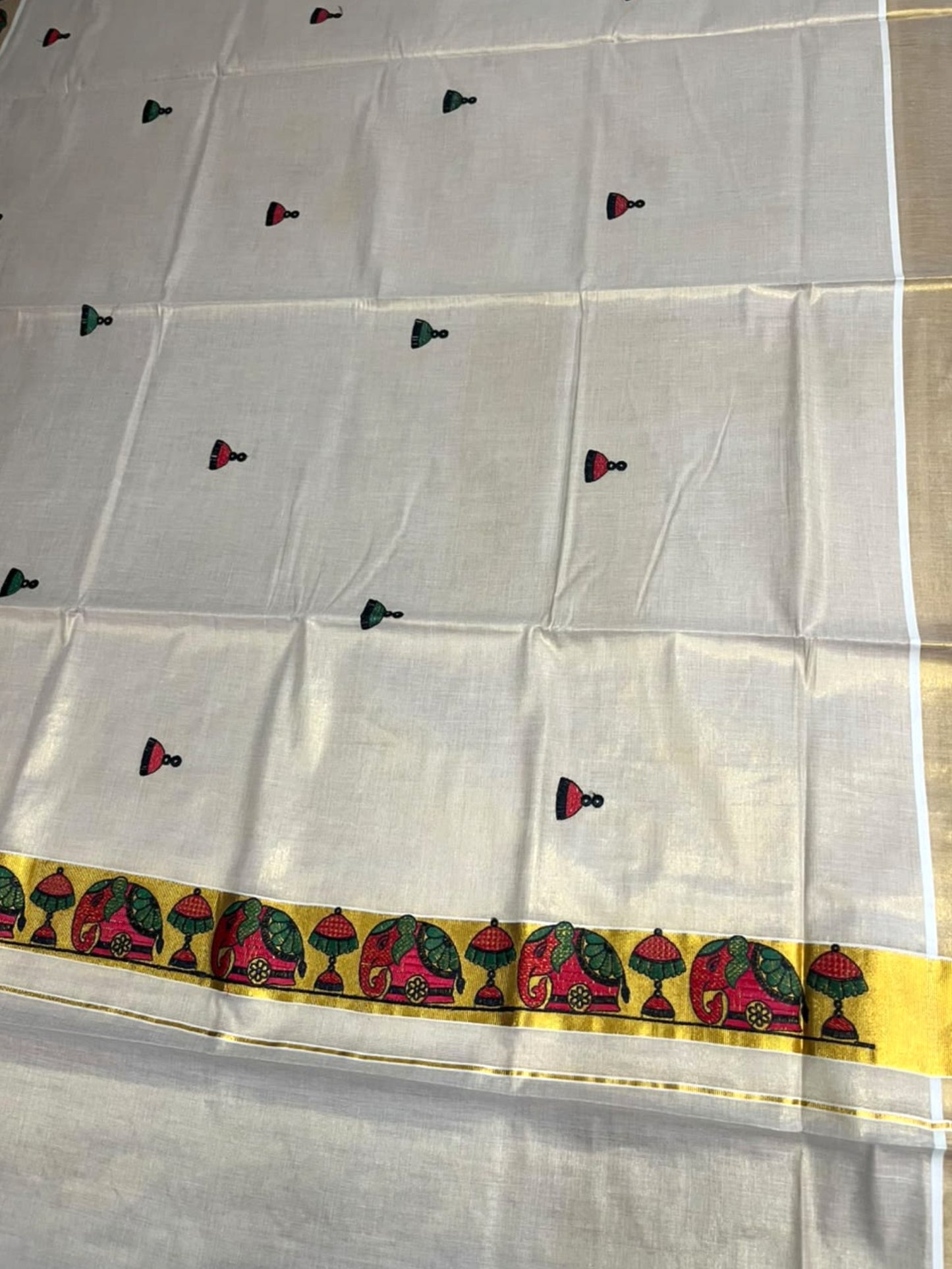 Southloom Tissue Kerala Kasavu Saree with Elephant Embroidery Design