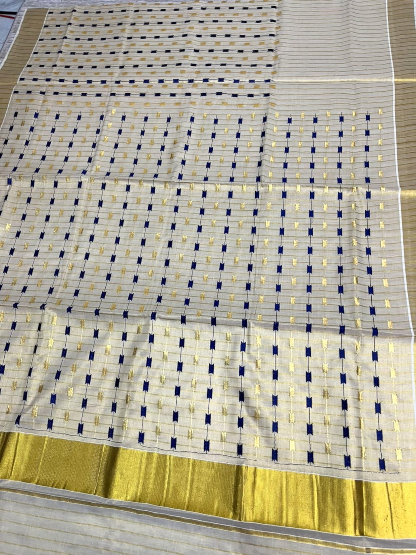 Southloom Tissue Kerala Kasavu Saree with Blue & Gold Embroidery Designs on Body