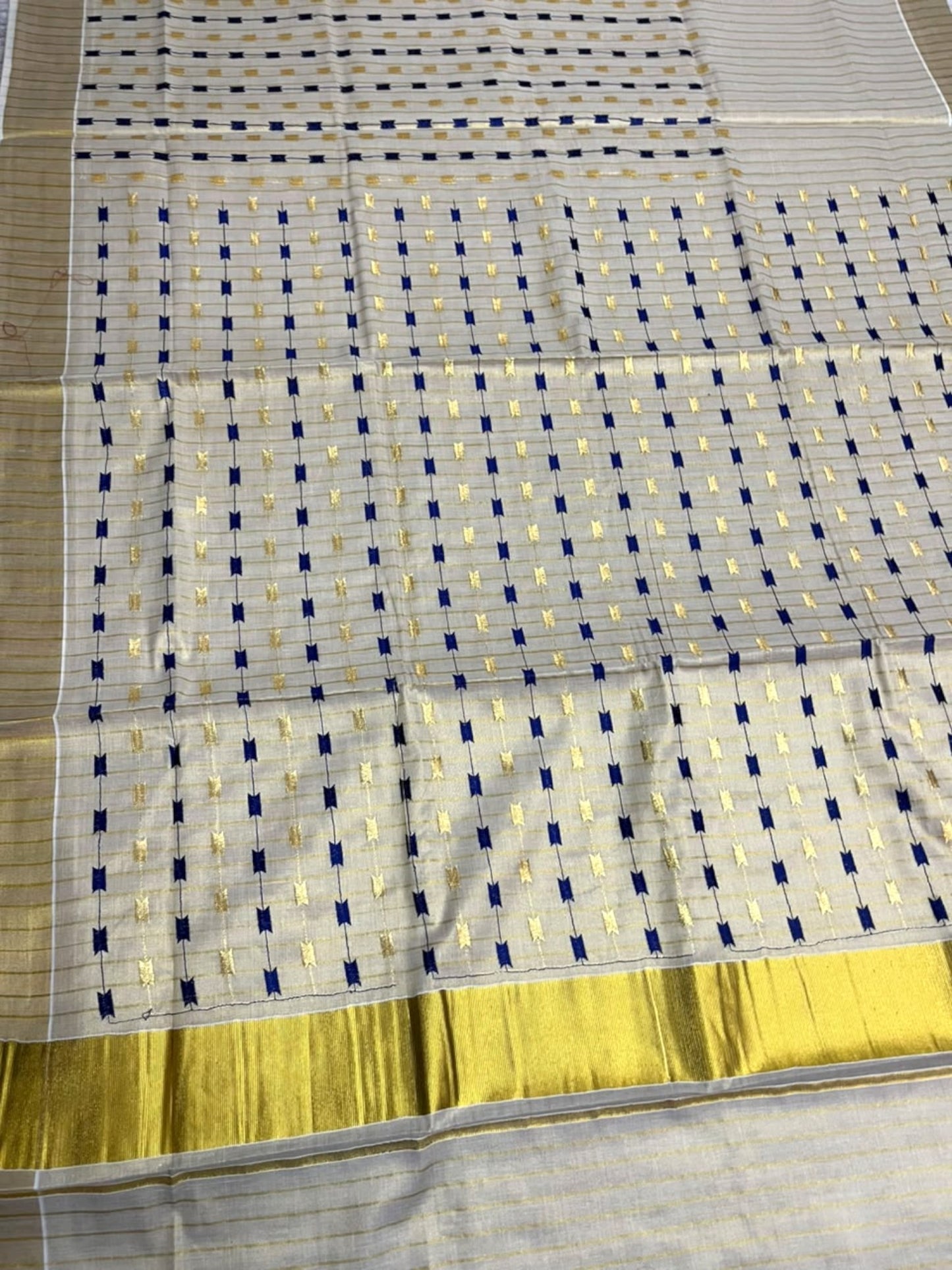 Southloom Tissue Kerala Kasavu Saree with Blue & Gold Embroidery Designs on Body