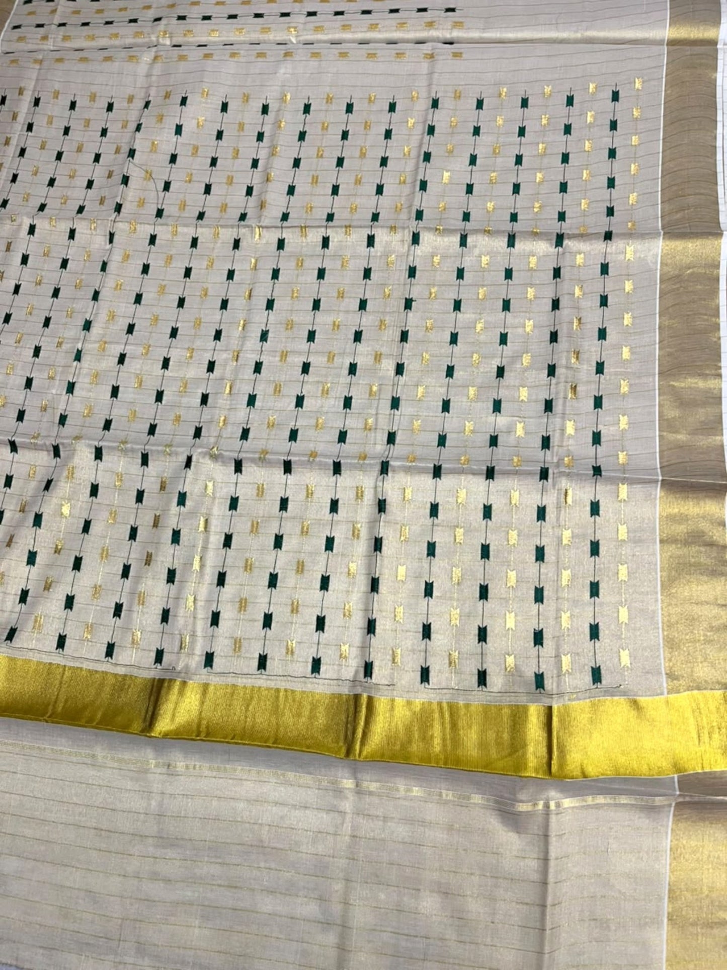 Southloom Tissue Kerala Kasavu Saree with Green & Gold Embroidery Designs on Body