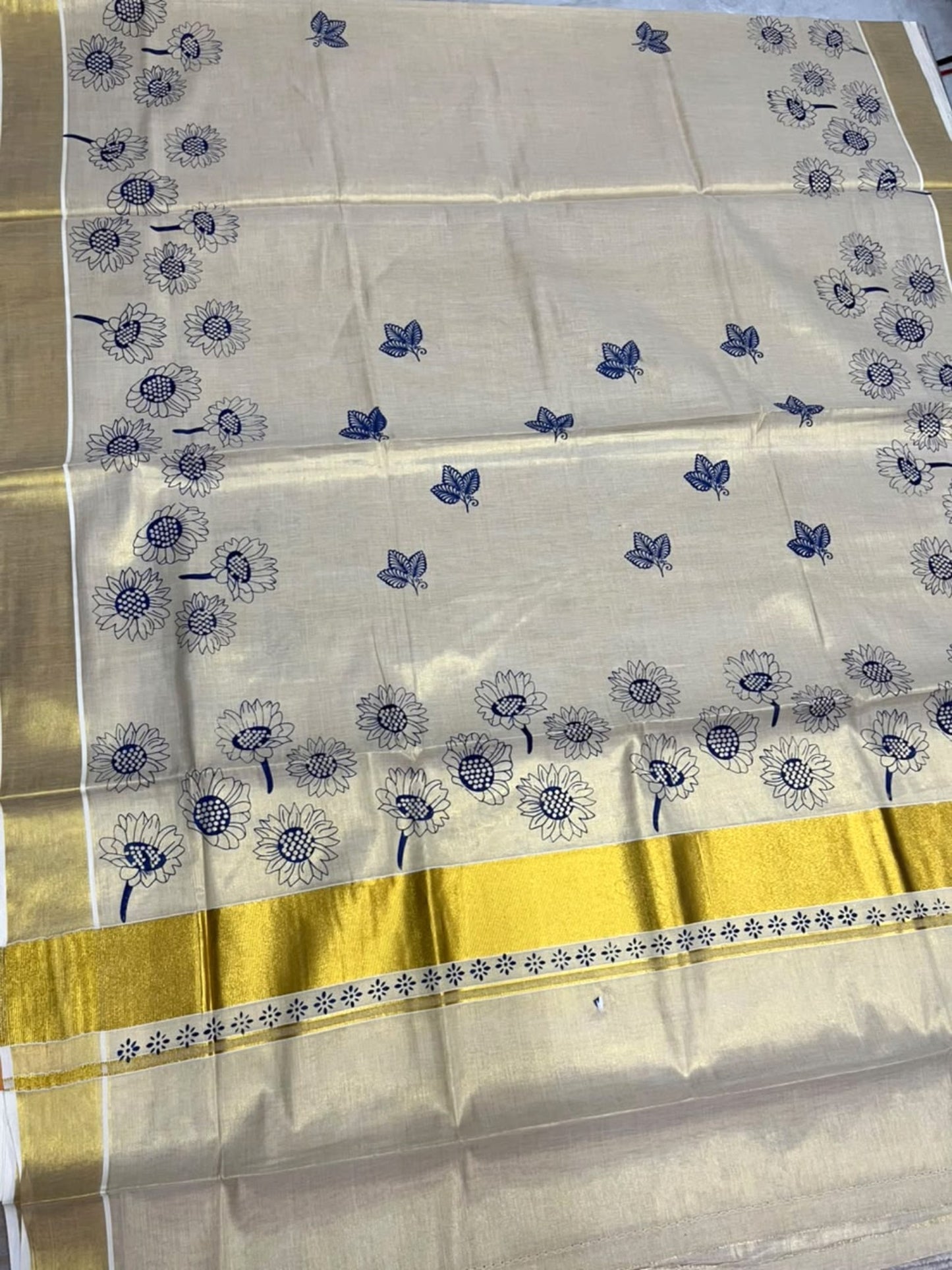 Southloom Kerala Tissue Kasavu Plain Saree with Blue Floral Printed work On Border